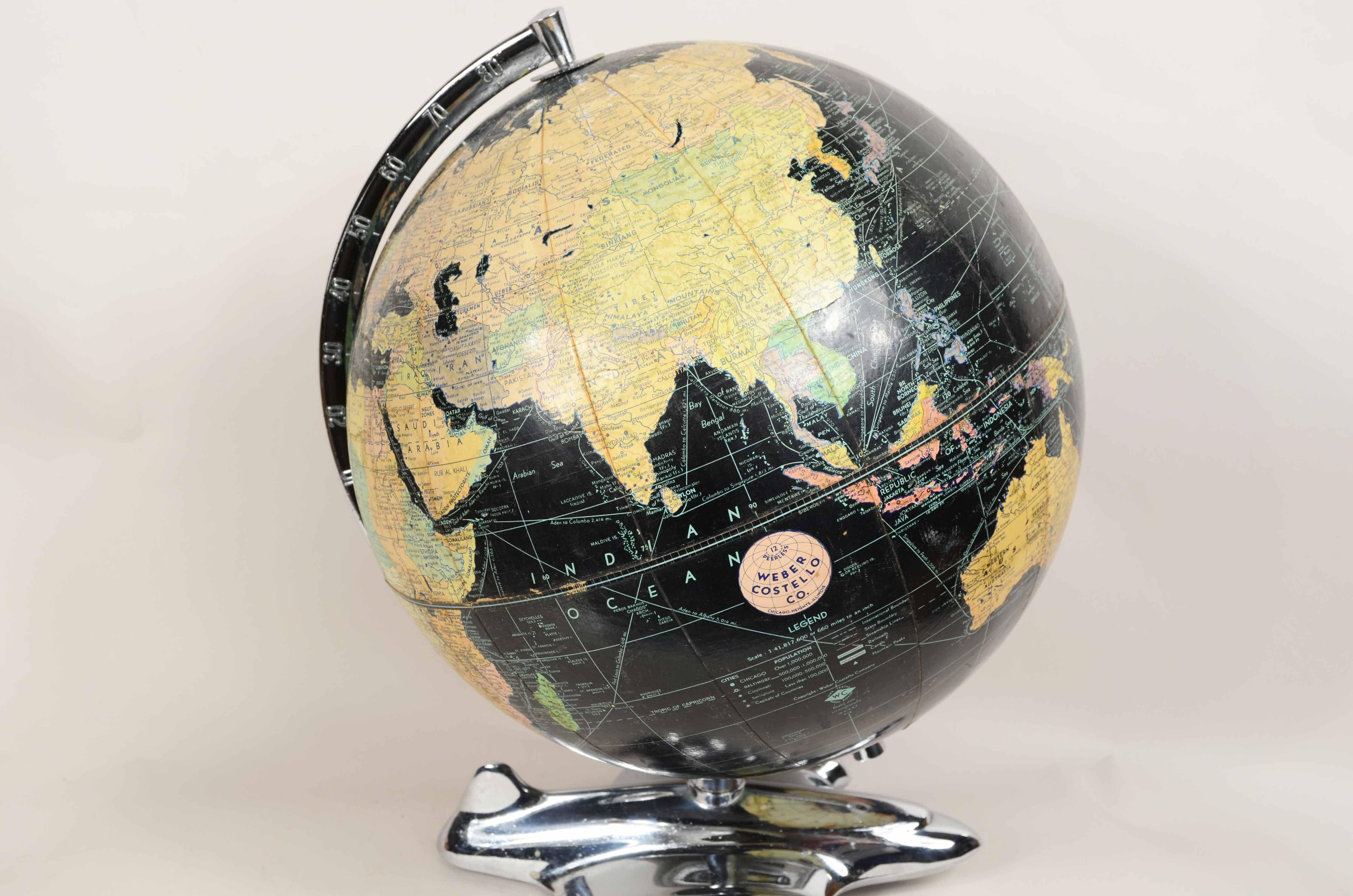 Paper Earth globe with airplane-shaped base published in 1949 by Weber Costello Co.  For Sale