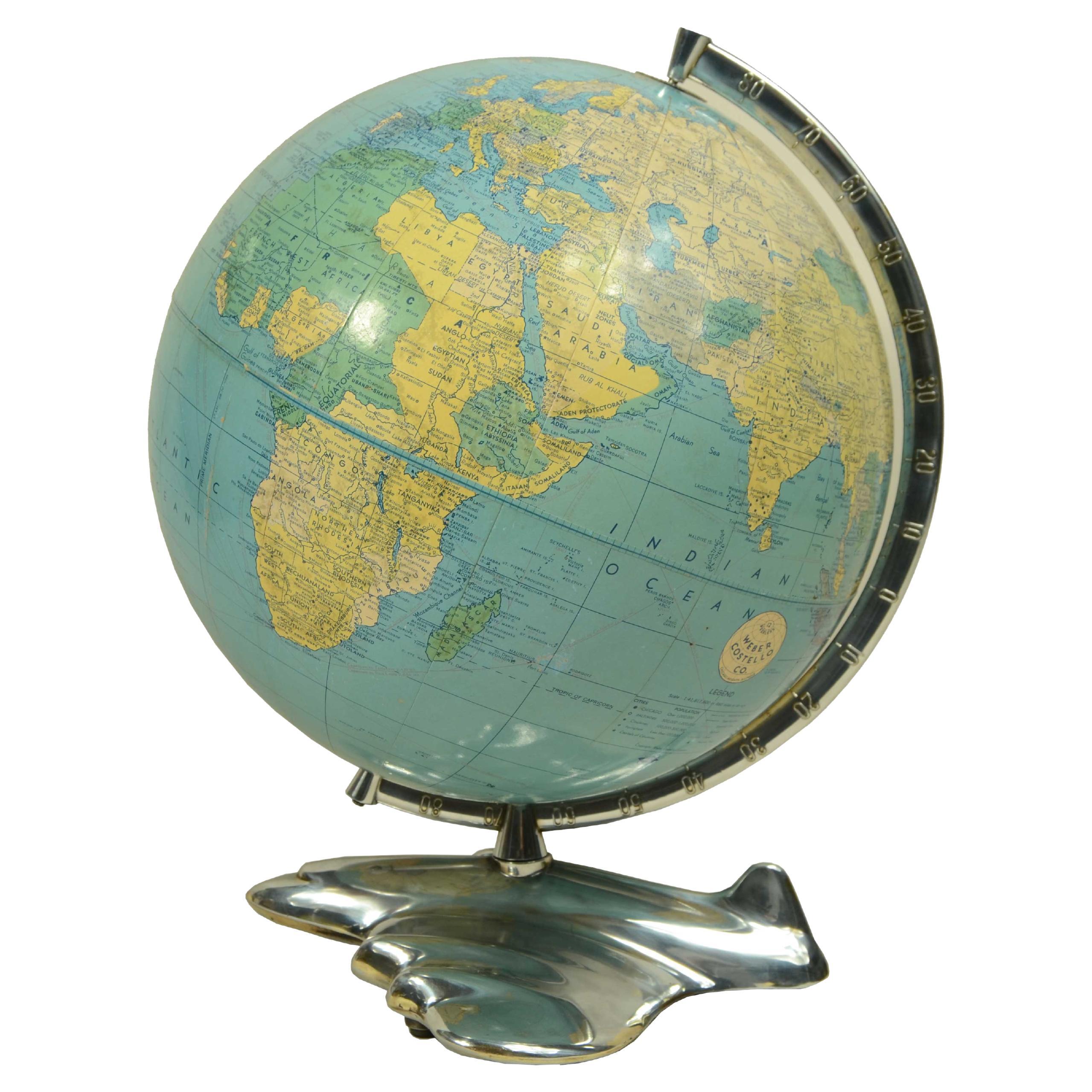 Globo terrestre con base a forma di aereo edito nel 1956 da Weber Costello Co in vendita