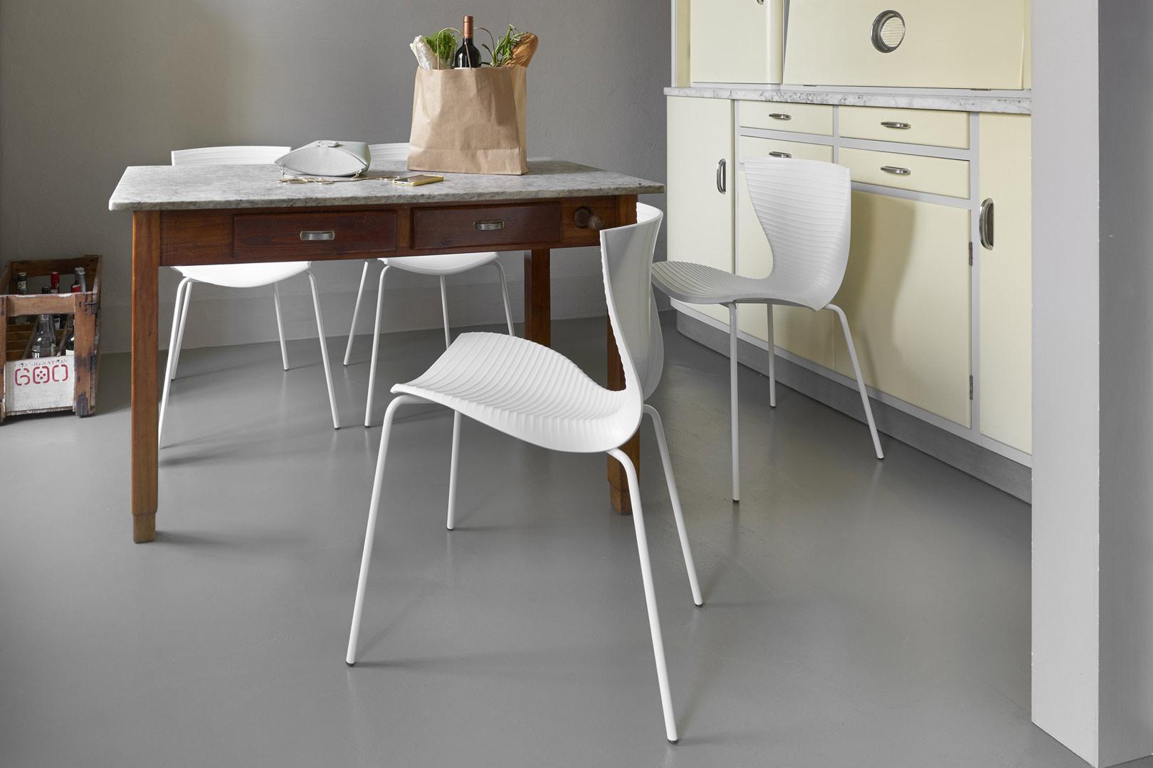 Gloria Chair by Marc Sadler
Dimensions: D 54 x W 56 x H 80 cm. Seat Height: 48 cm.
Materials: Polypropylene and steel chassis.
Weight: 6 kg.

Available in two different color options: white or black. This product is suitable for indoor and outdoor