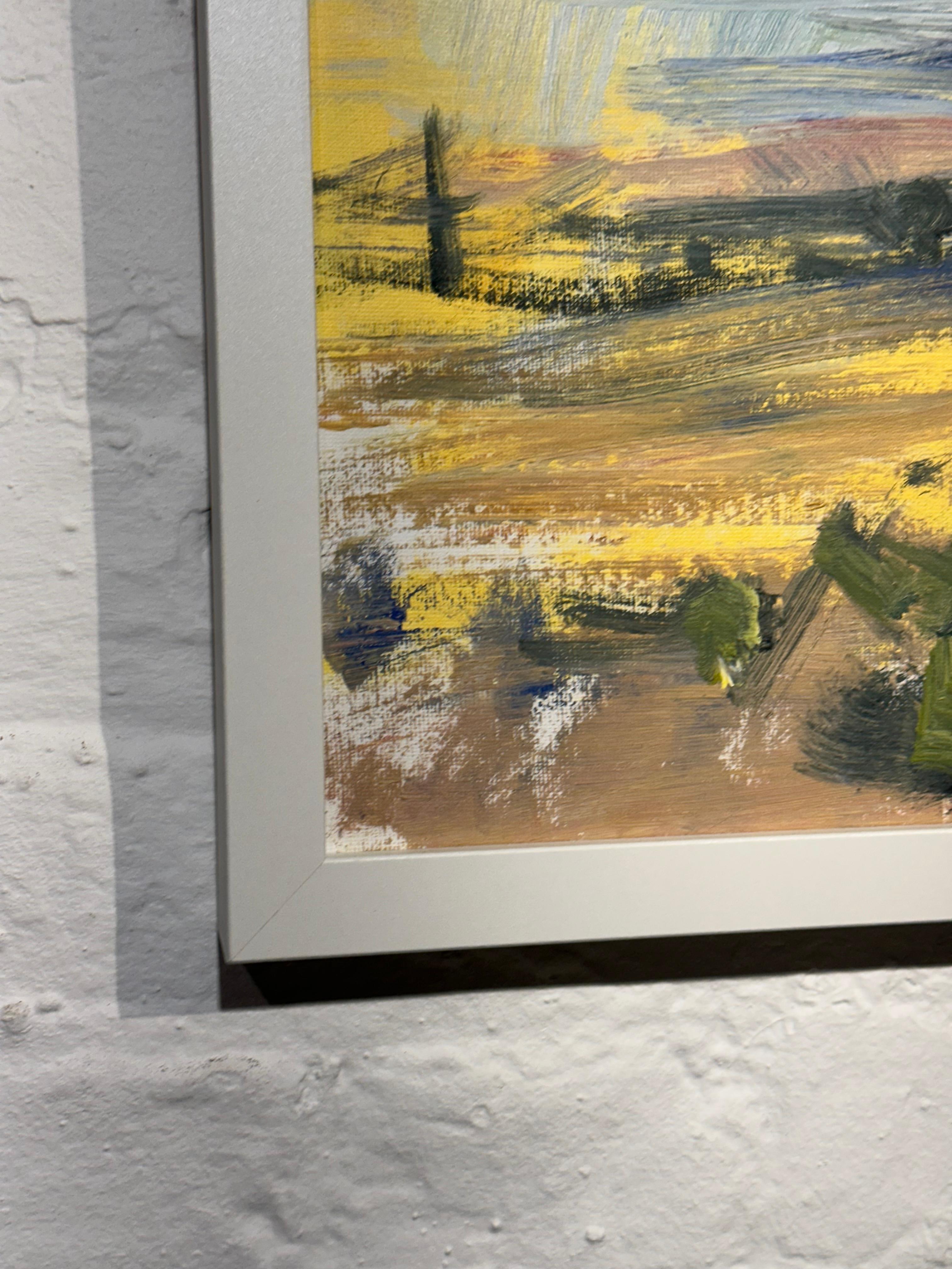 Imagine standing on a gentle rise at day’s edge. Before you, the world unfolds in sweeping fields of gold and pale green, brushed with faint violets and rose. The air is dry and fragrant, humming with quiet. There are no trees to break the horizon,