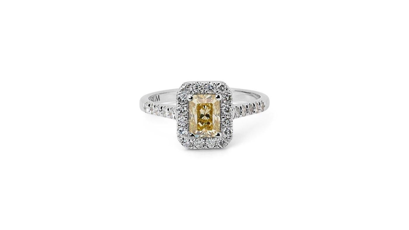 A stunning halo ring with a dazzling 1.02 carat radiant natural diamond. It has 0.41 carat of side diamonds which add more to its elegance. The jewelry is made of 18K White Gold with a high quality polish. It comes with GIA certificate and a fancy