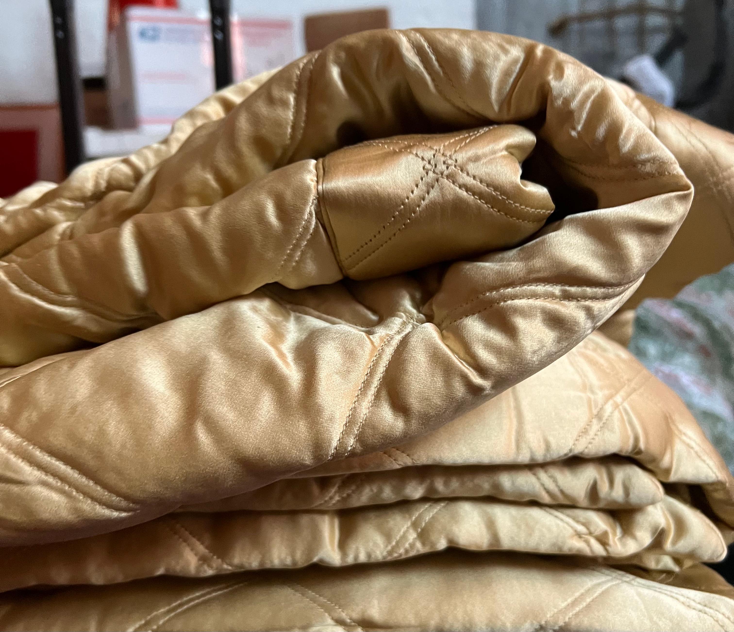 gold quilted throw