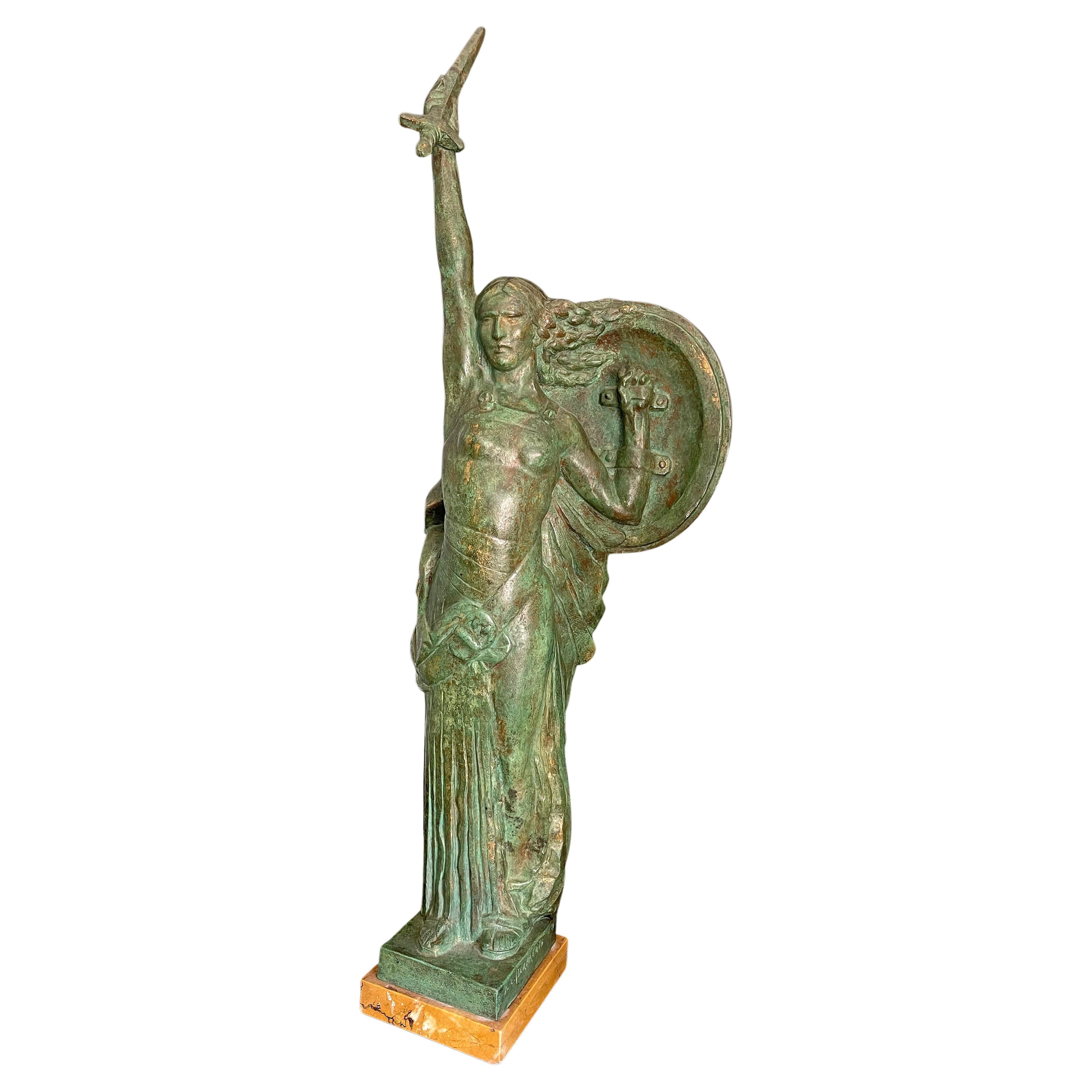 Rare and striking, this bold, bronze allegorical sculpture is entitled 