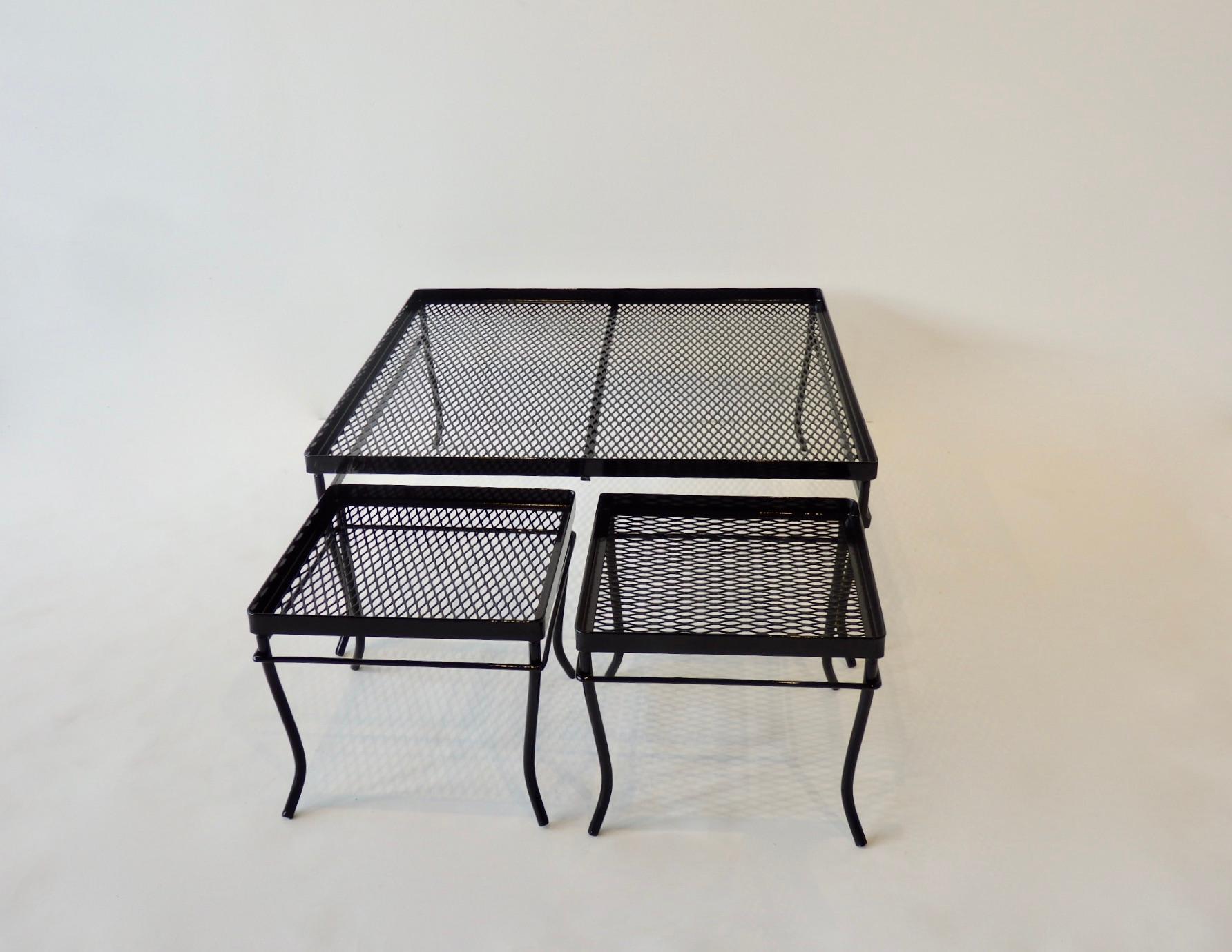 Restored in gloss black powder coat large square Woodard cocktail table. Two smaller tables fit underneath or sit on top. Large table measures 28.5 