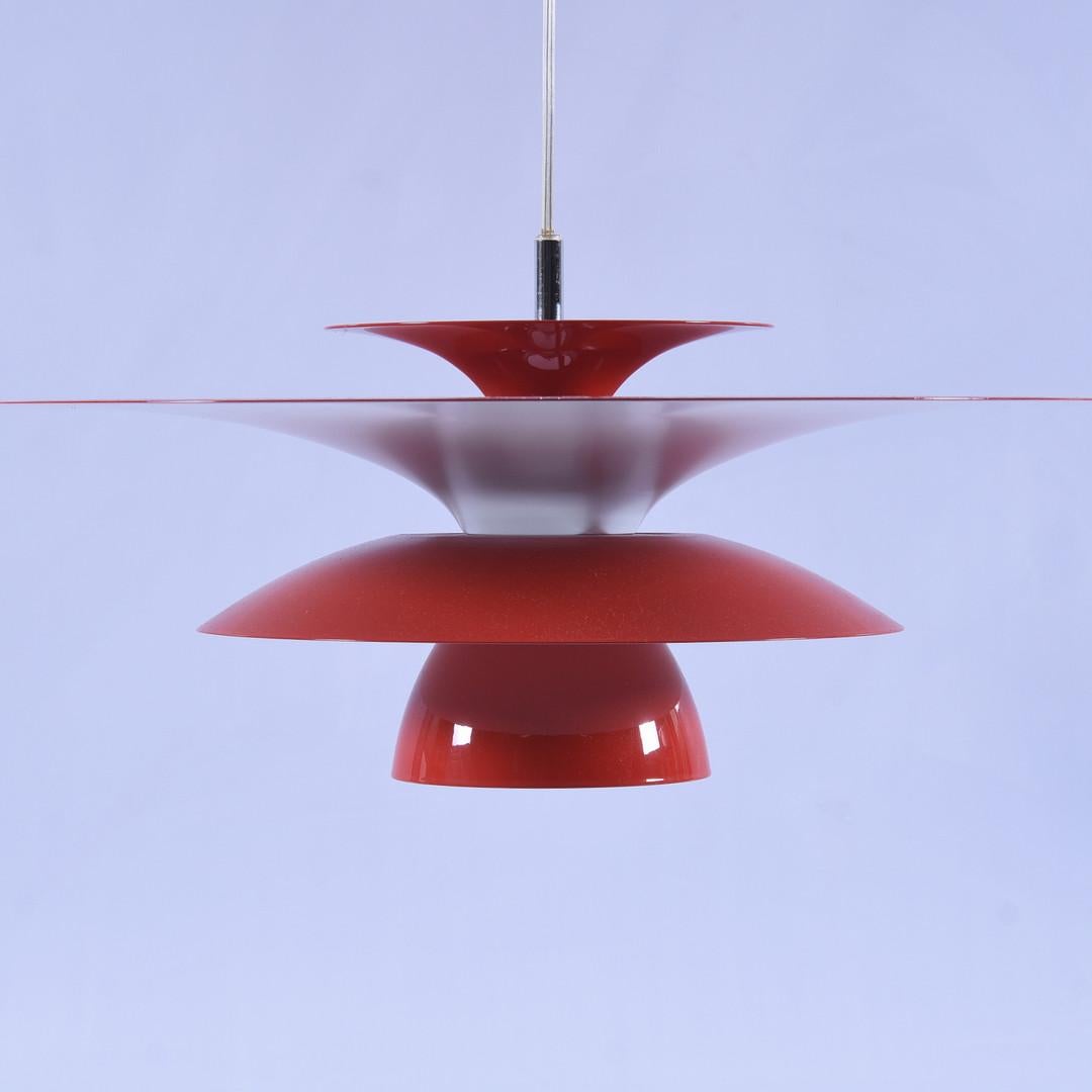 Red lacquered metal ceiling lamp, contemporary, but original version with halogen bulb (not LED).   Fun, bright with great lines. Halogen light bulb.  Great to pair with midcentury items it to get the mid century look but at a great price.  I
