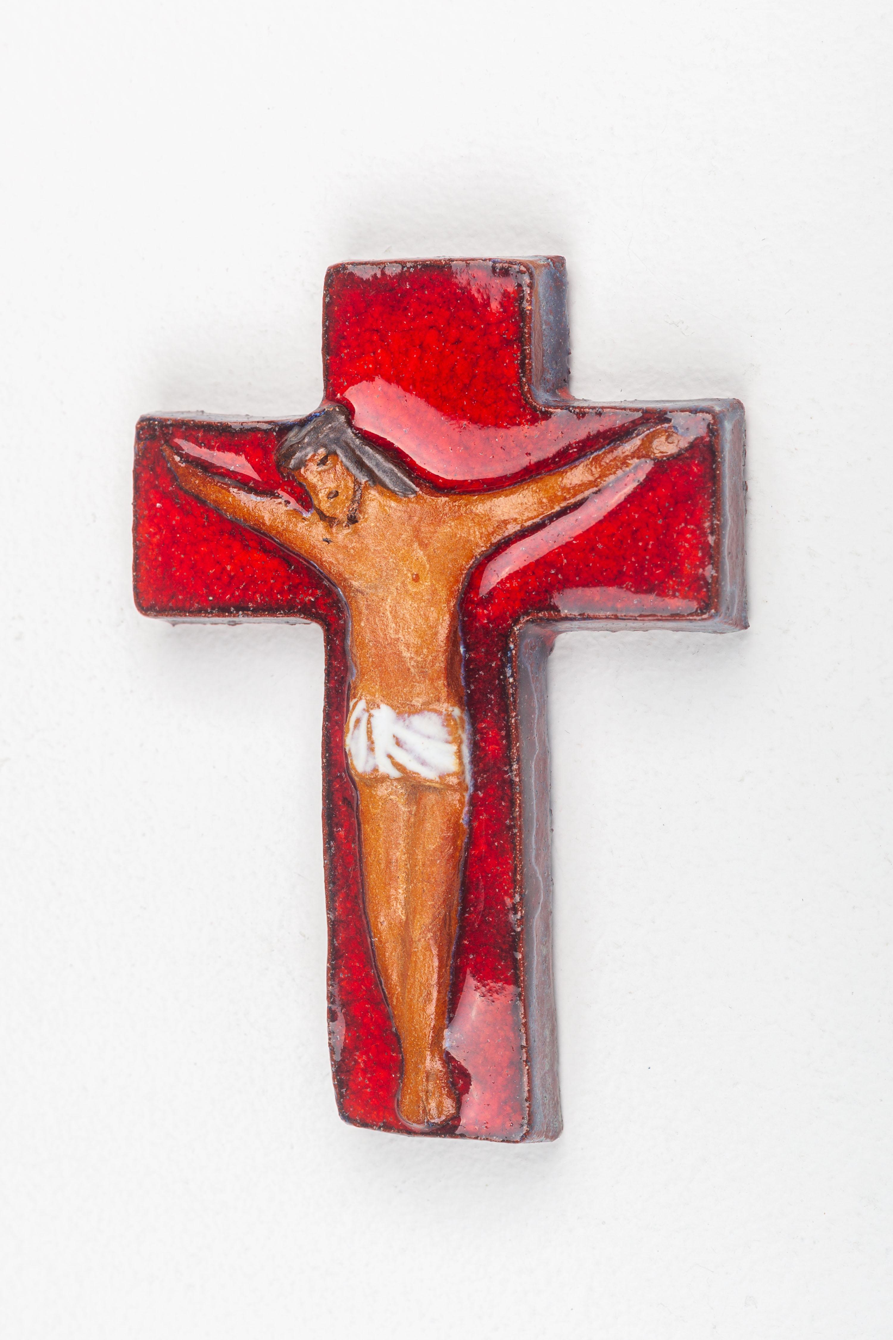 European Glossy Red Ceramic Cross with Abstract Matte Christ Figure in Earth Tones For Sale