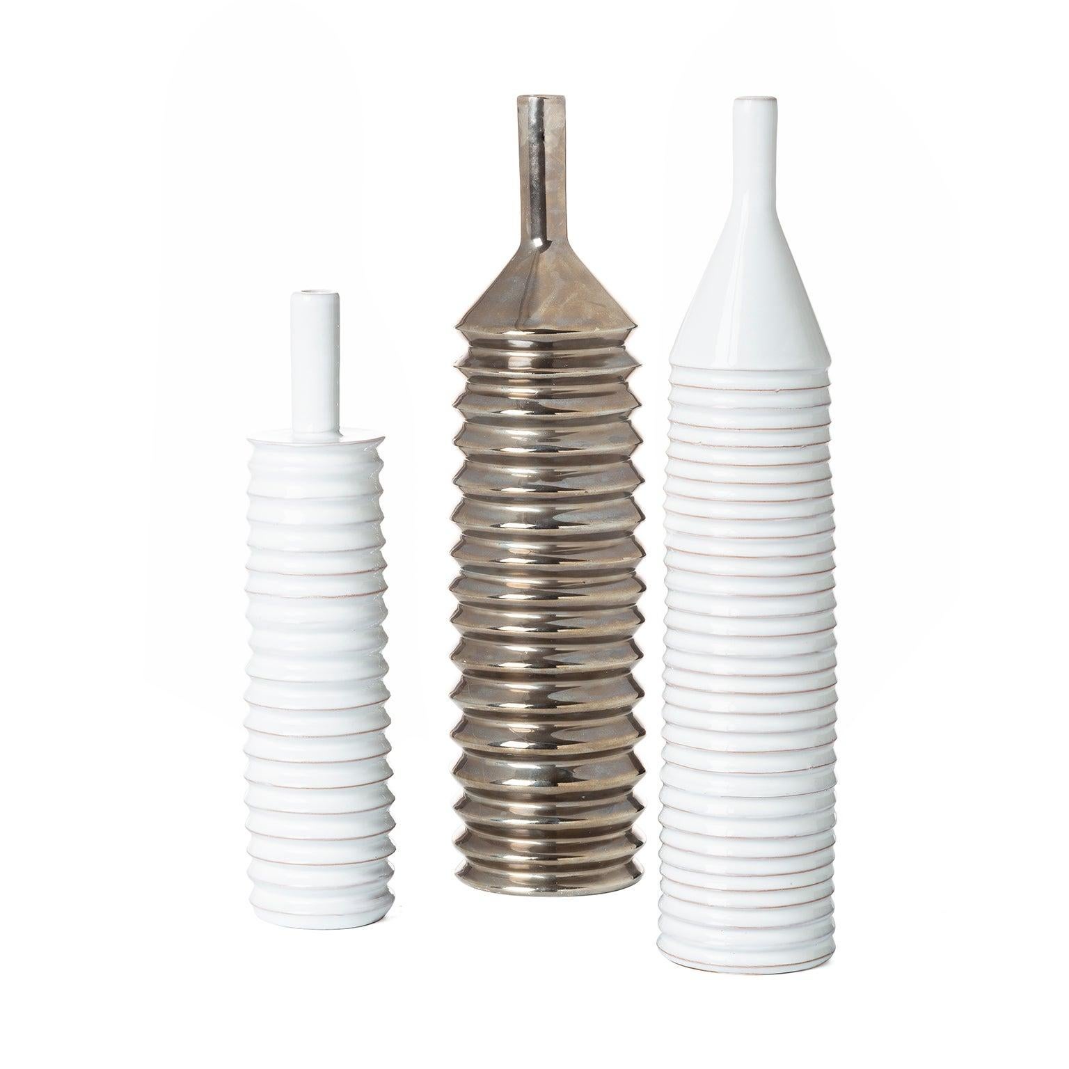 Set of decorative bottles made on the potter’s wheel with plastic relief.
Work born in the 1980s out of the author's research into traditional techniques and innovative ideas, a synthesis of minimalism and postmodernism.
Research recalling the