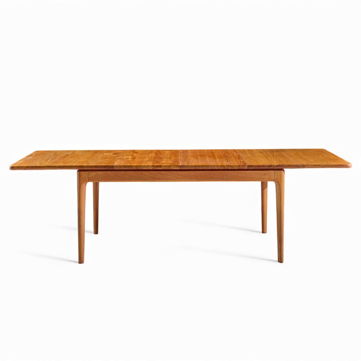 Glostrup Møbelfabrik Mid Century Danish Teak Hidden Leaf Dining Table with 2 Leaves

This table measures: 60.25 wide x 41.25 deep x 29 inches high, with a chair clearance of 24 inches, each leaf measures 19.25 inches wide, making a maximum table