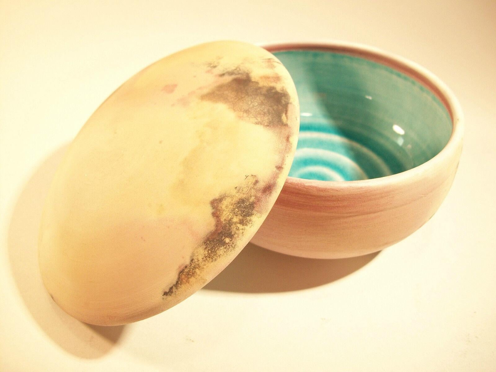 GLOVER - Vintage wheel thrown studio pottery dome lidded smoked raku box - unglazed exterior - bright turquoise glaze to the interior - signed on the base - circa 1980's.

Excellent vintage condition - minor chips to the inside rim of the lid (as