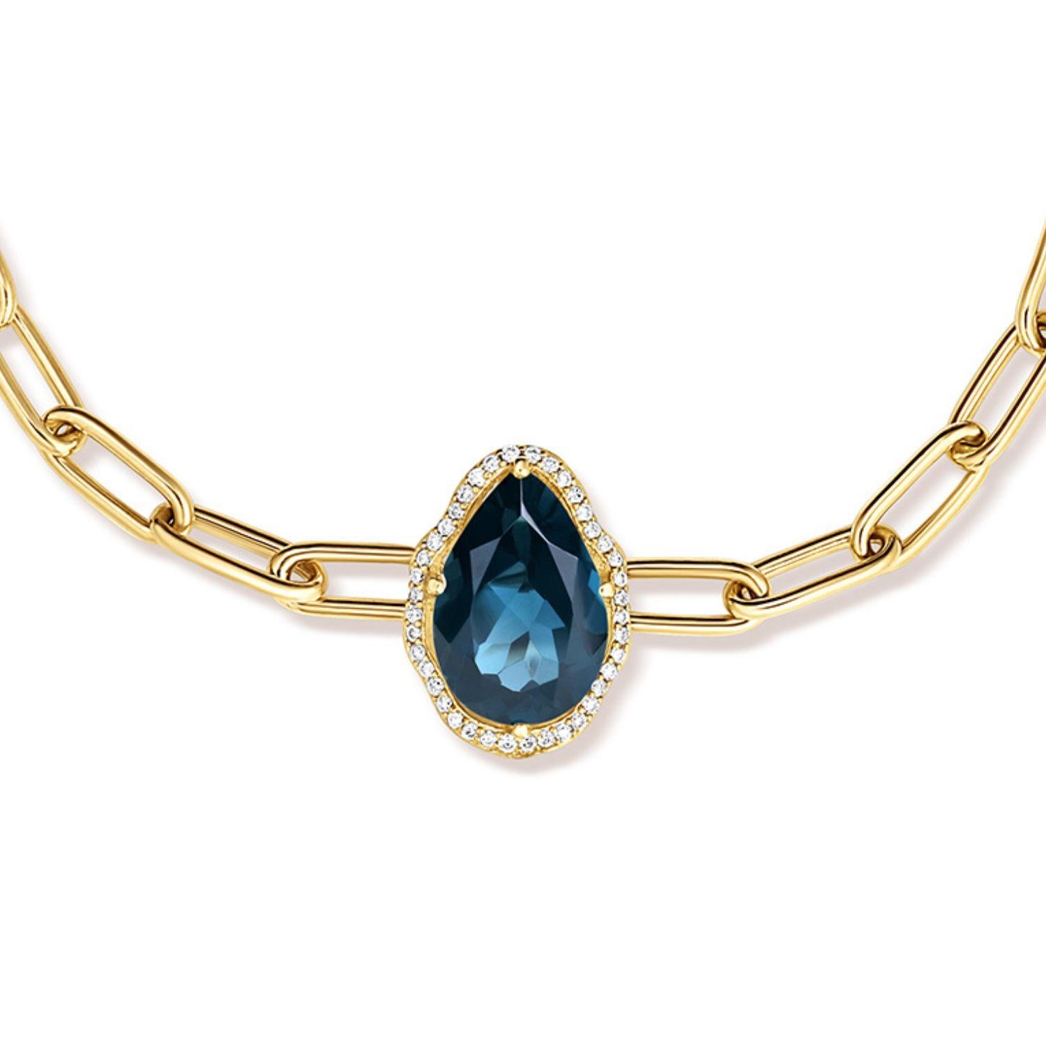 Glow Bracelet. 18K yellow gold (750/1000), with a 2.96 carat pear-cut London blue topaz and 0.1 carats of round brilliant-cut diamonds. 18K yellow gold chain with adjustable length of 17 cm.