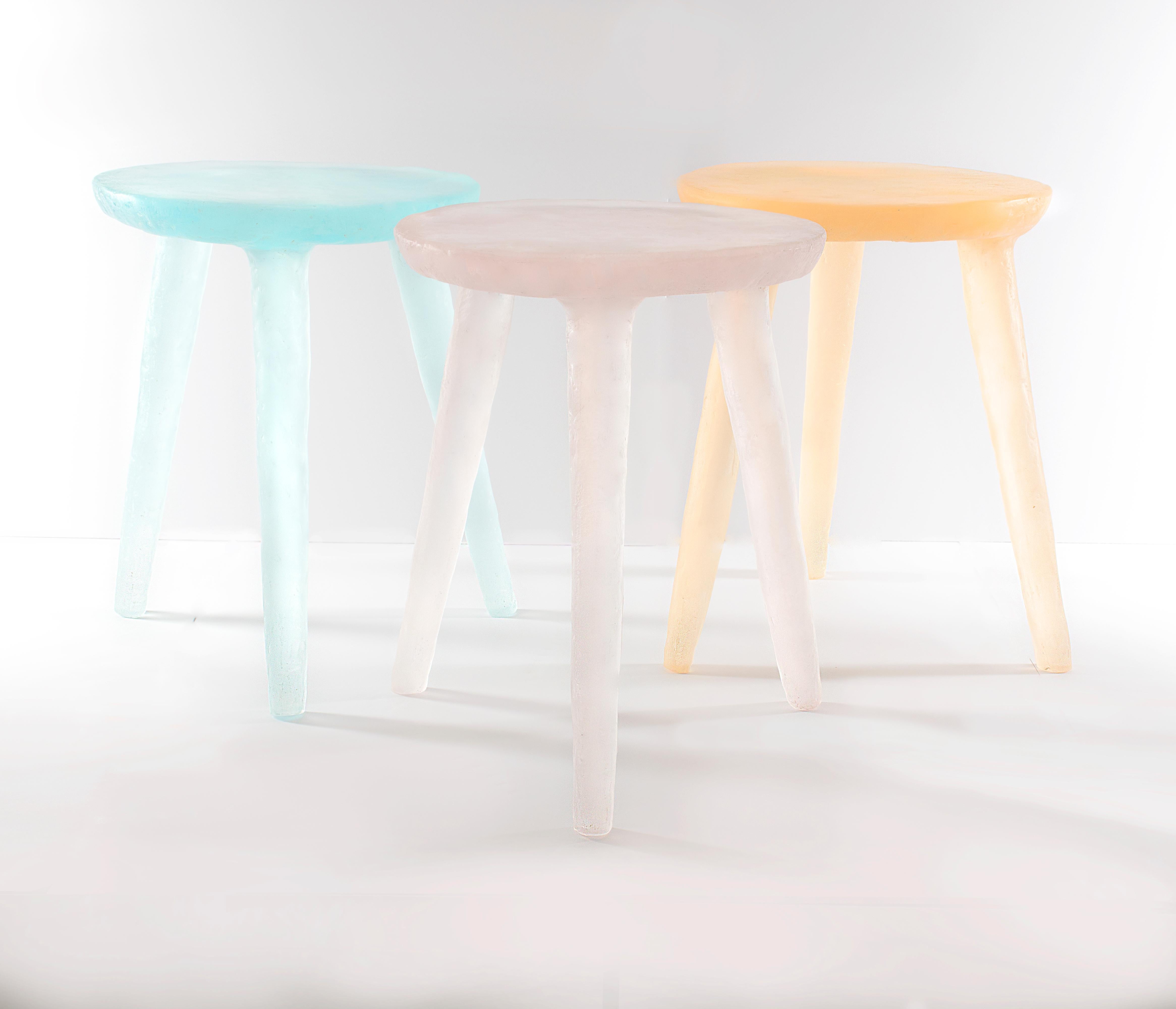 Translucent and whimsical, the glow side table / stool can be used as a side table or stool. They are handcrafted from a variety of recycled plastics both thermoset and thermoplastic. A specific blend of the plastics is combined in large molds. Once