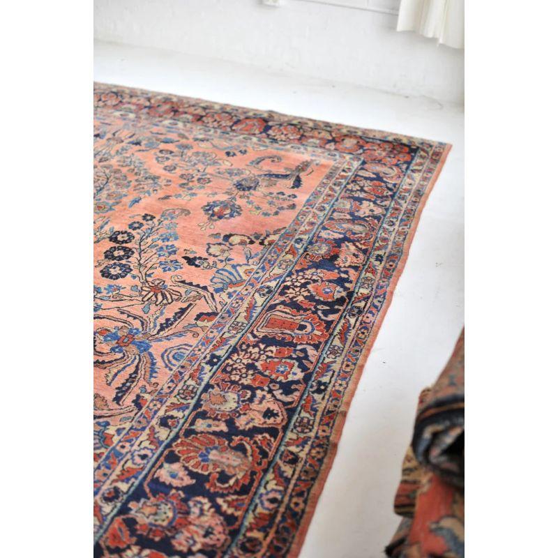 Early 20th Century Glowing Antique Botanical Sarouk Rug with Coral, Indigo & Peacock Blue Color For Sale
