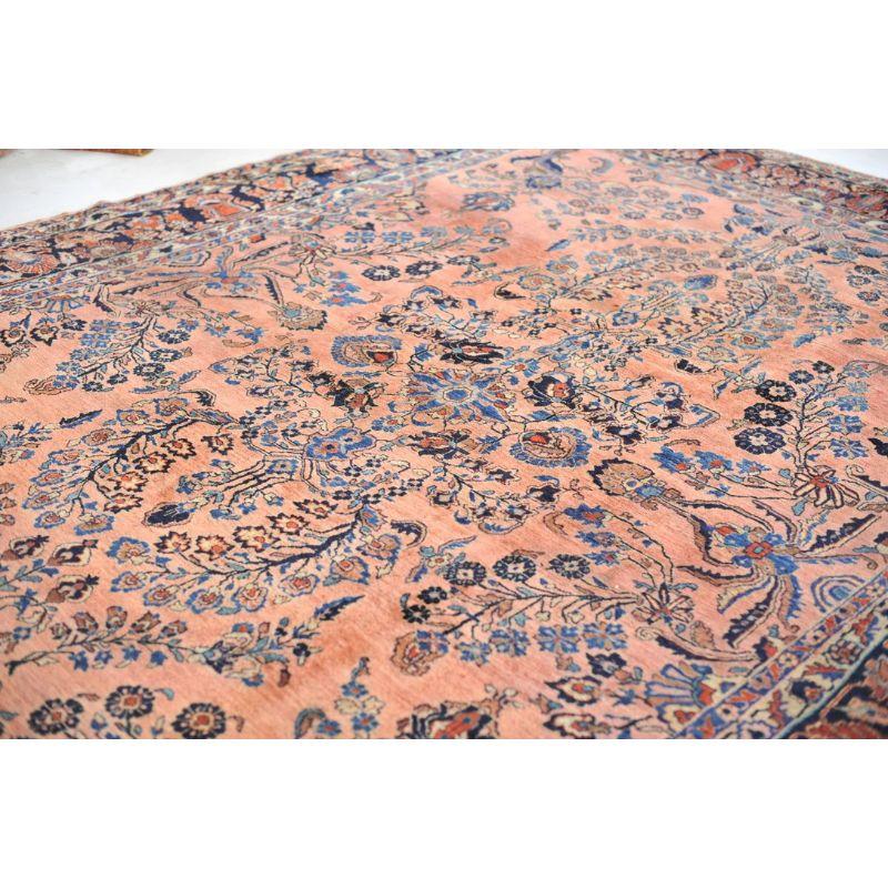 Wool Glowing Antique Botanical Sarouk Rug with Coral, Indigo & Peacock Blue Color For Sale
