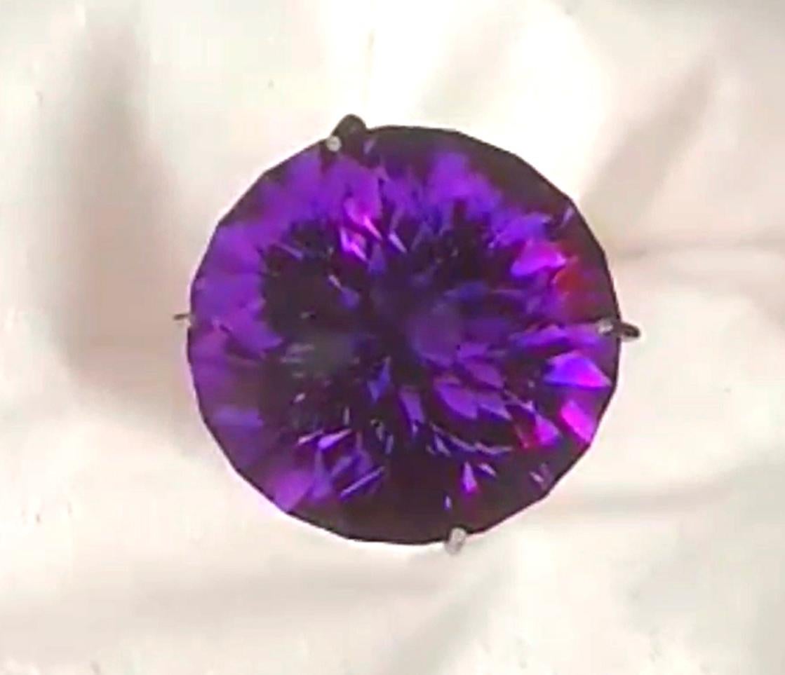 Our Favorite Amethyst Type and another example of our Unique/Fine Amethyst, which has a velvety purple with lots of blue under certain lights.  A Royal Purple with Glowing Blue Highlights. This is an 8.57ct Round - our first round faceted in this