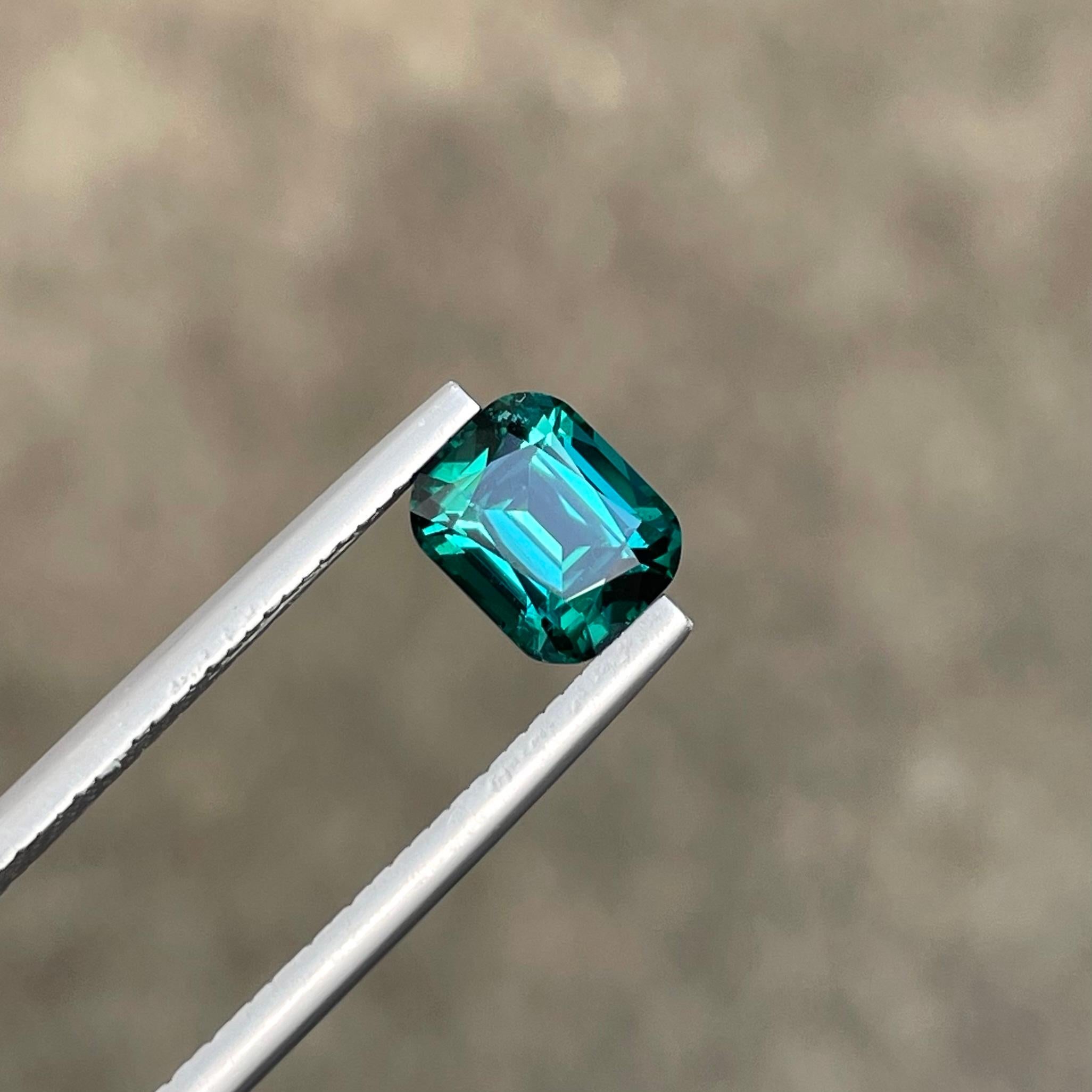 Weight 1.70 carats 
Dimensions 7.4 x 6.0 x 4.9 mm
Treatment None 
Origin Afghanistan 
Clarity VVS (Very, Very Slightly Included)
Shape Cushion
Cut Fancy Cushion


A Greenish-blue tourmaline, also known as Paraiba tourmaline, is a captivating