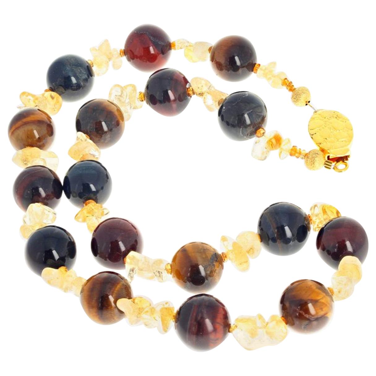 These beautiful highly polished 14 mm round TigerEye gems are enhanced with polished natural chunks of yellow Citrine and accented with tiny gem cut sparkling little Citrine gemstones. The Necklace is 19 inches long and the clasp is gold washed. 