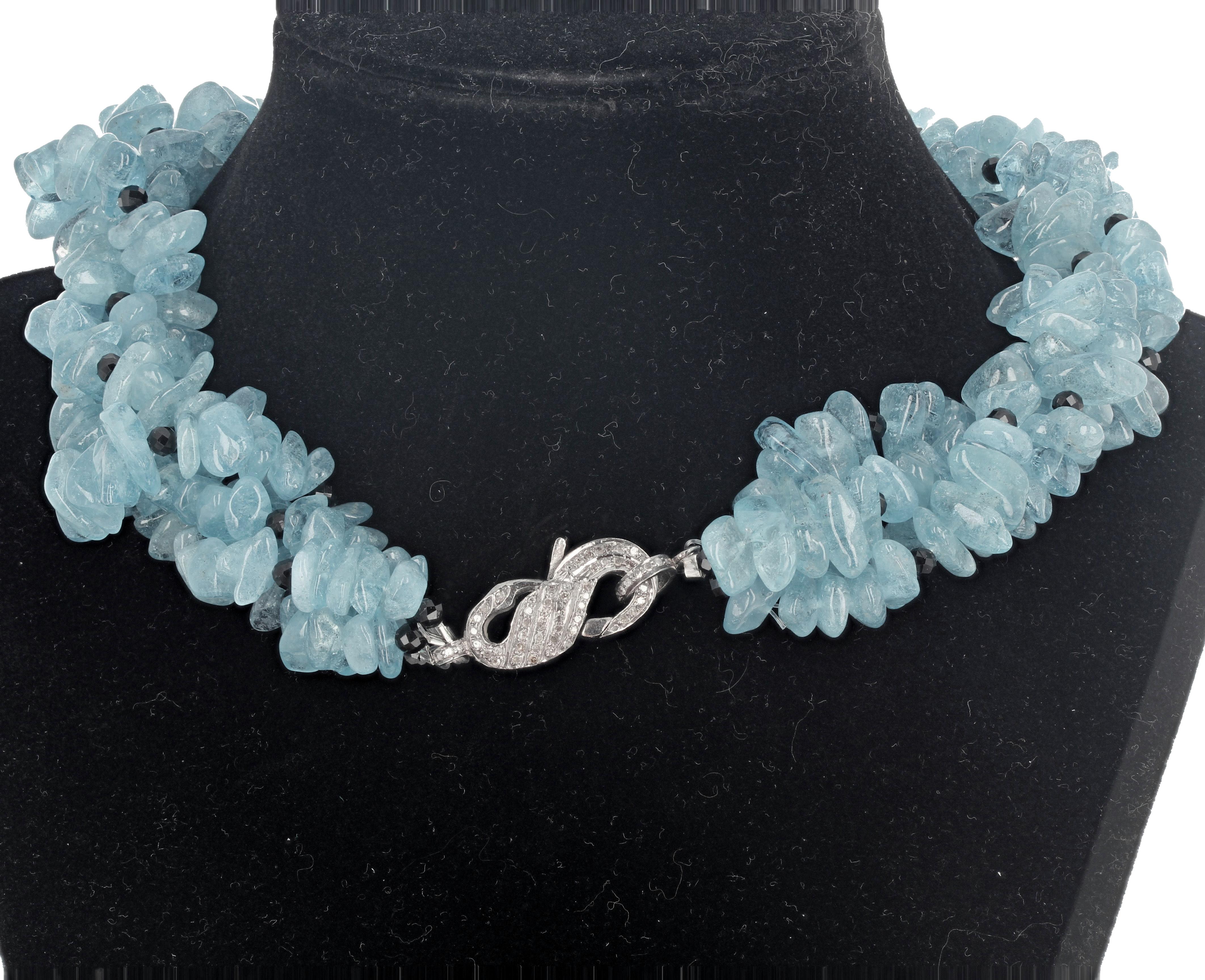 This beautiful multi-strand (4 strands) natural chunkychips of highly polished Aquamarines can sit different ways around your neck.  It is 16 inches long with a diamond encrusted darkened sterling silver lever (easy to work) clasp.  You can flip it