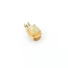 Glowing Opal Pendant in 14k yellow gold