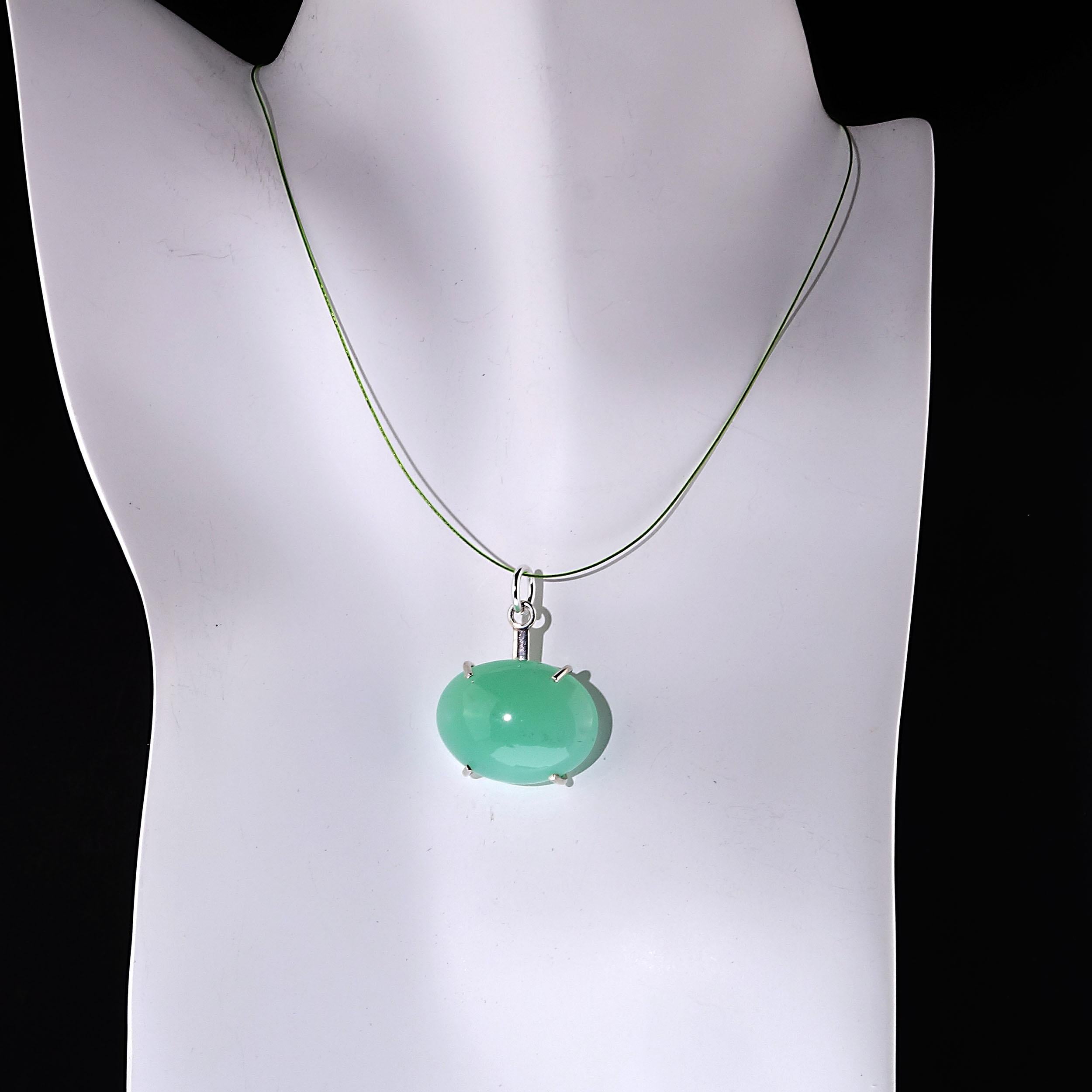 Unique lovely soft Green Glowing Chysophrase cabochon set east-west in a Sterling Silver setting.  Pair this one of a kind pendant with everything in your wardrobe. It is 28.65 carats of loveliness.  The Chrysophrase cabochon itself measures 24 x 18