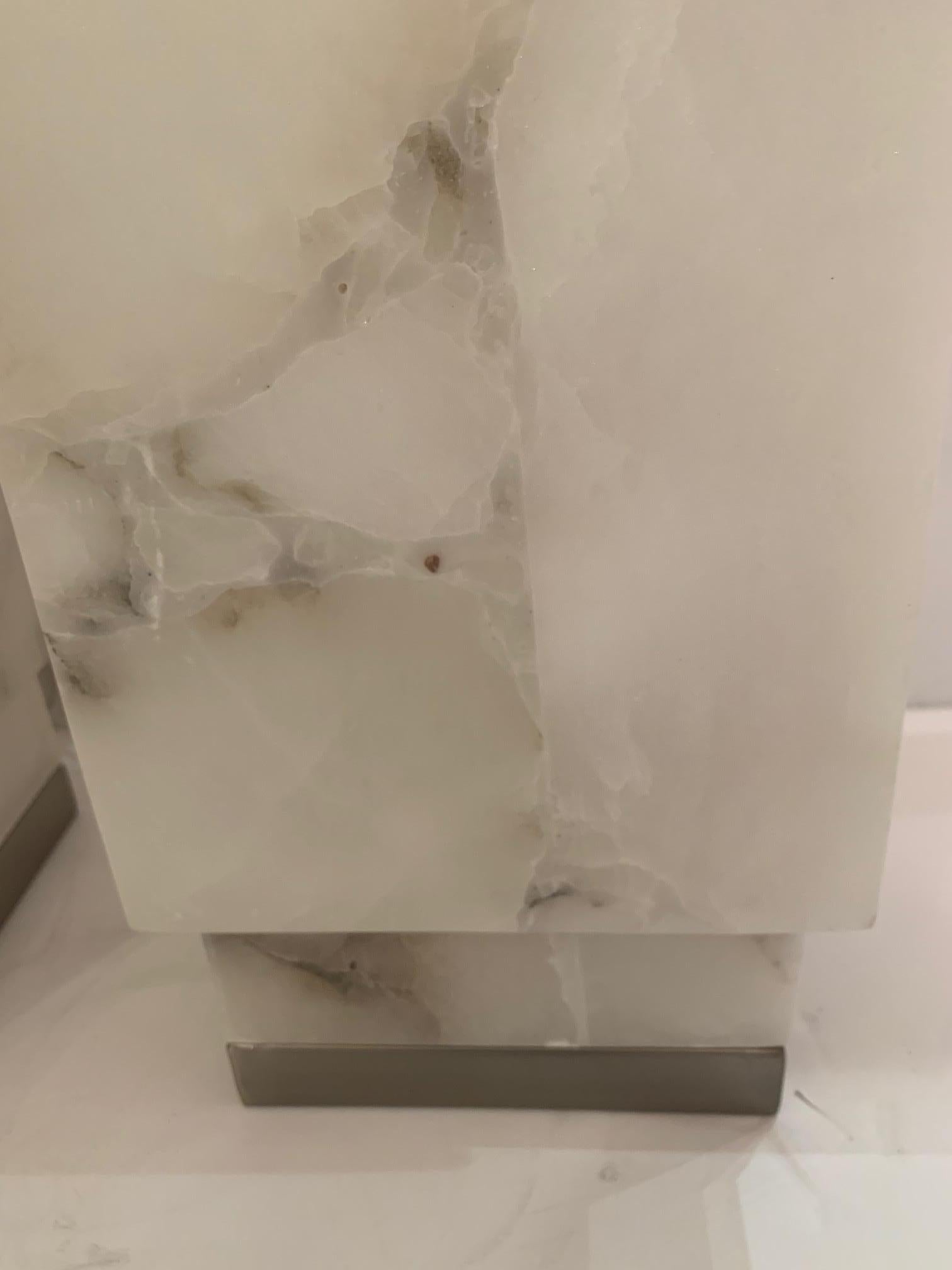 Glamorous mid century modern marble square columnar table lamp having a white and gray palette and chrome base.  Like a modern piece of sculpture that adds a glow to a special spot in a room.