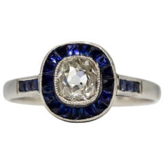 Glowing Platinum Diamond and Sapphires Halo Ring