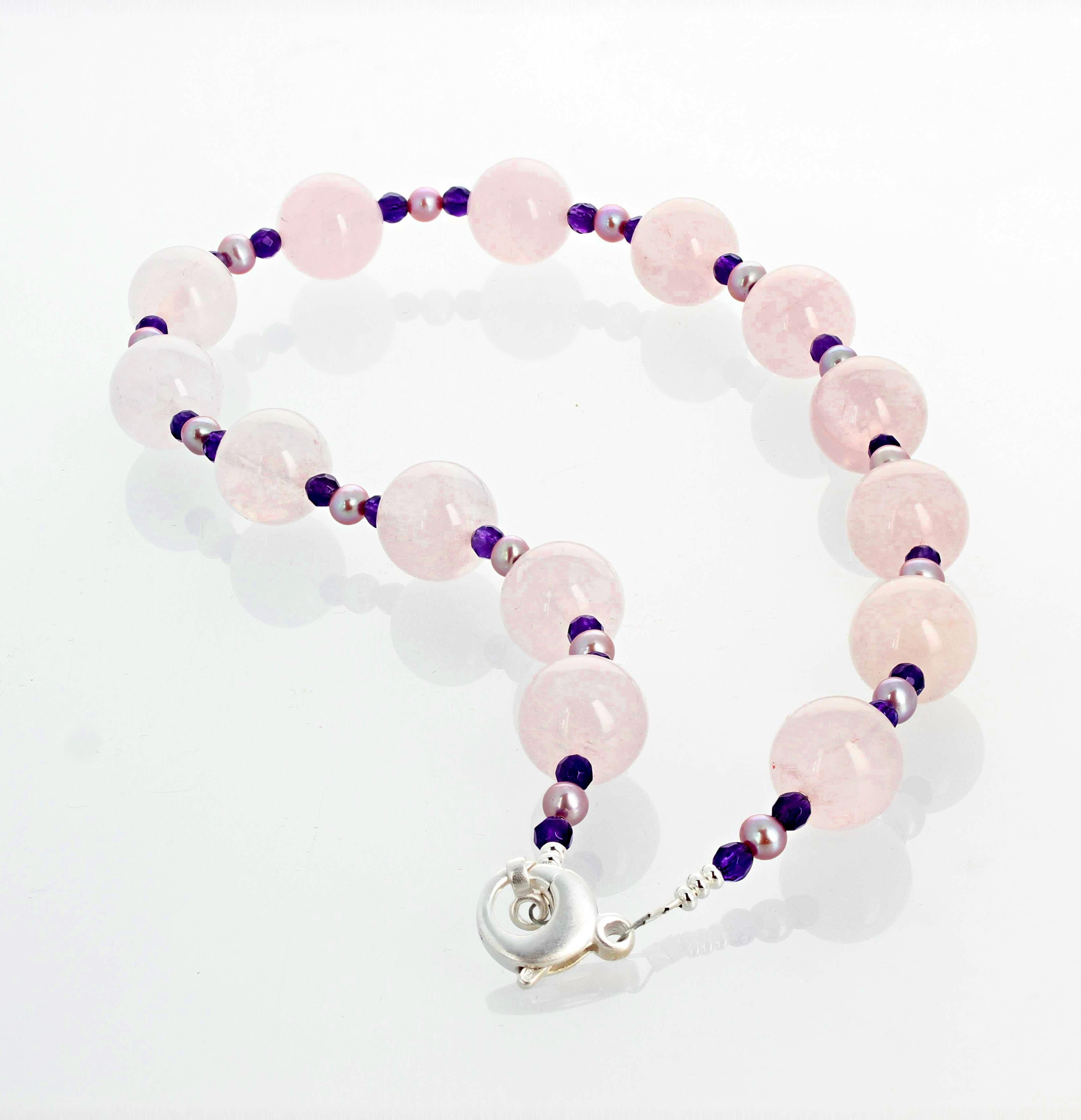 Elegant lightly translucent glowing round natural pink real Rose Quartz - 14mm - enhanced with little gem cut natural real Amethysts and very pale glowing little cultured real Pearls set in this lovely single strand necklace with sterling silver