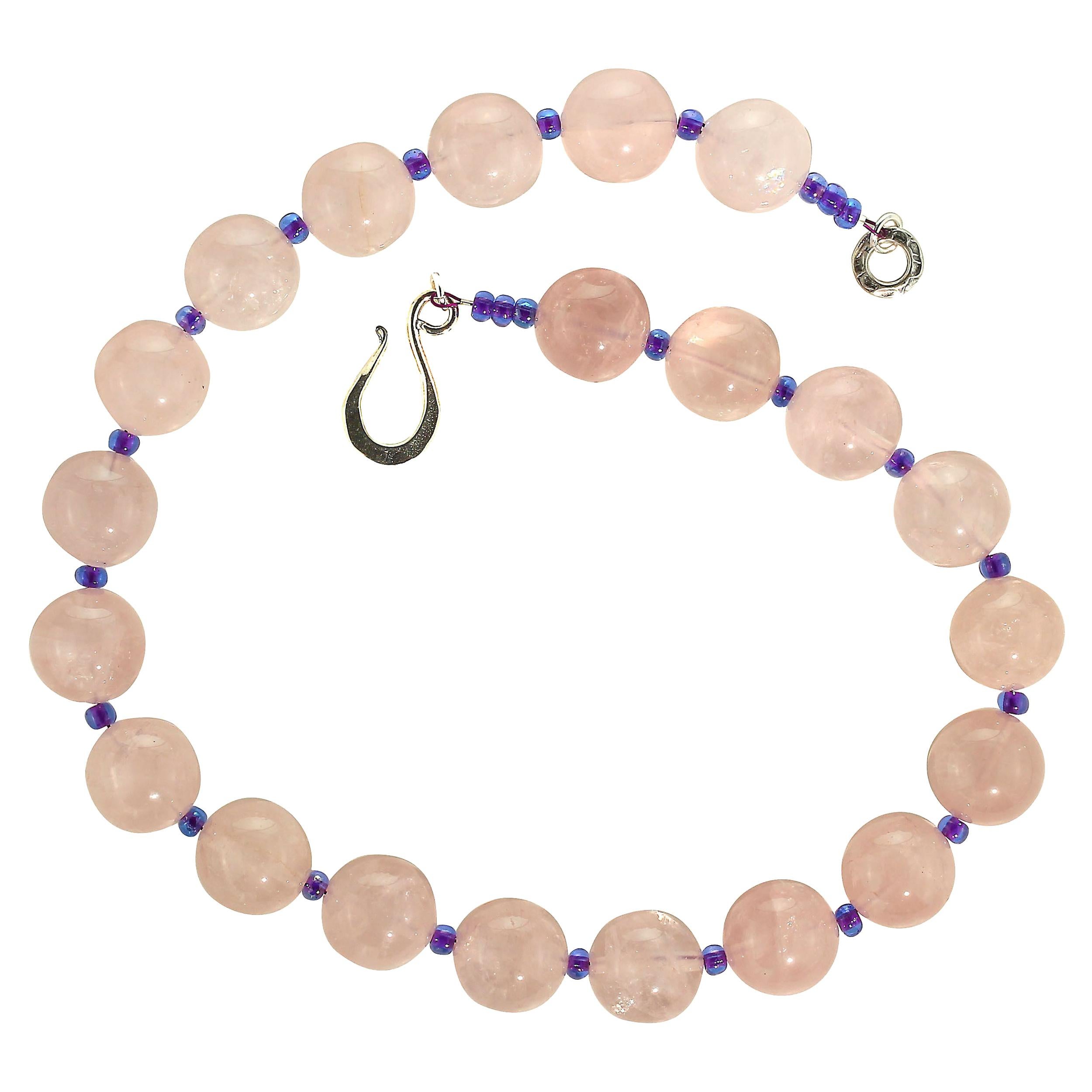 Elegant, handmade Rose Quartz and Czech bead necklace. This unique necklace features 16 MM translucent Rose Quartz accented with 3 MM sparkling purple Czech beads. A hammered Sterling Silver hook and eye clasp secures this gorgeous 18 inch necklace.