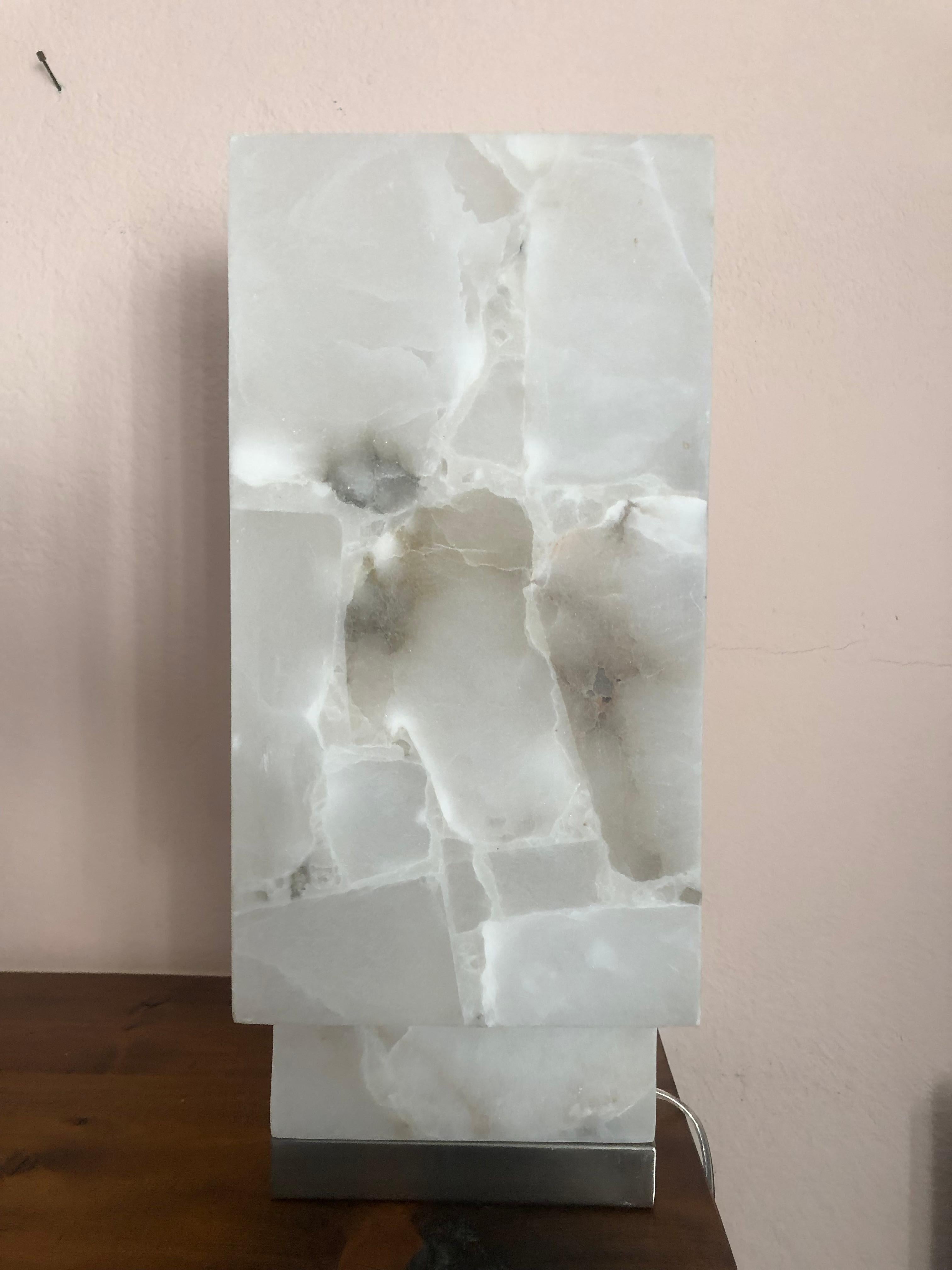 Glamorous sculptural Mid-Century Modern marble square columnar table lamp having a white and gray palette and chrome base. Like a modern piece of sculpture that adds a glow to a special spot in a room.
