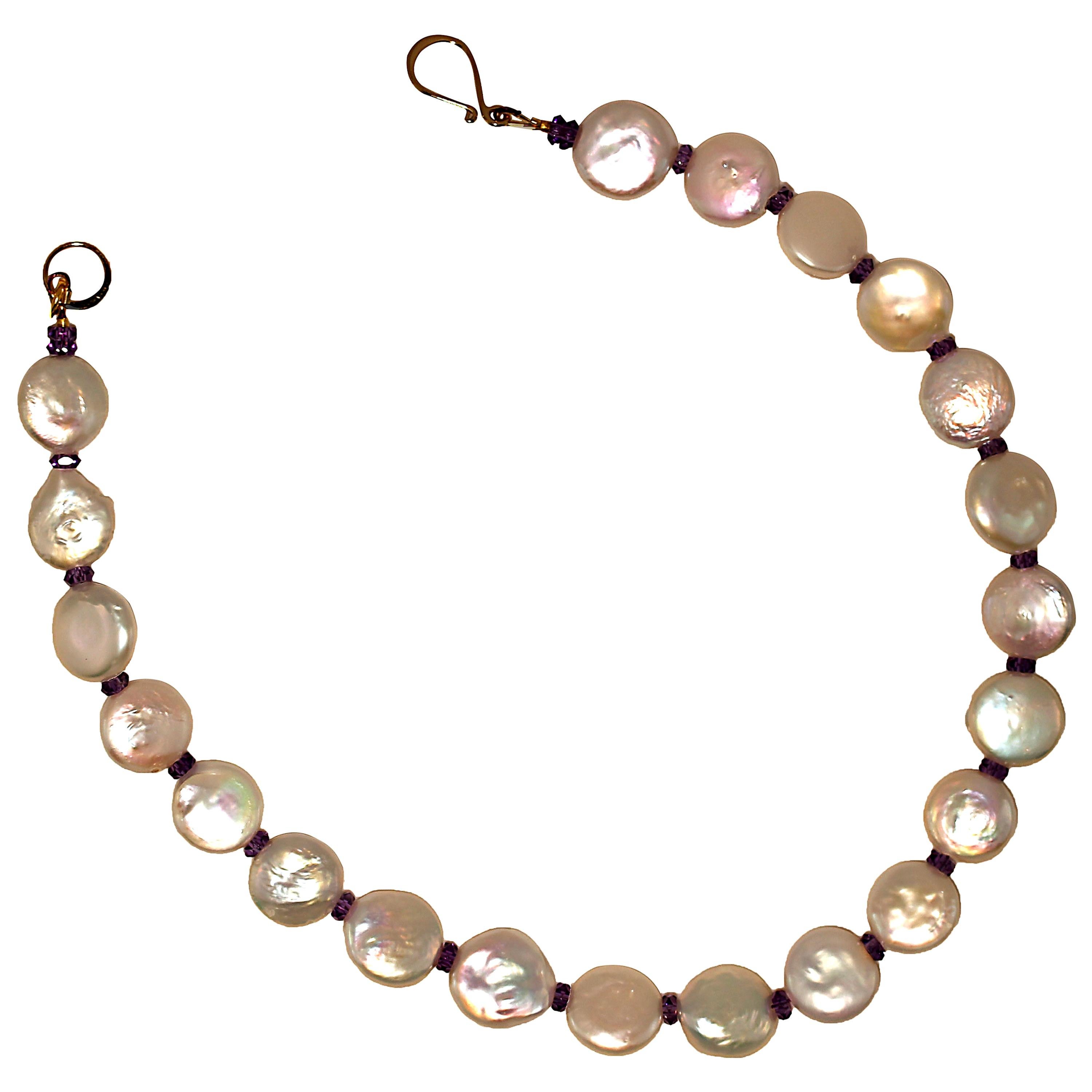 Own the jewelry you desire.

Handmade choker necklace of glowing white Coin Pearls accented with faceted rondelles of Amethyst.  This unique 15 inch choker necklace features 14MM iridescent Coin Pearls and 4MM faceted sparkling purple Amethysts. It