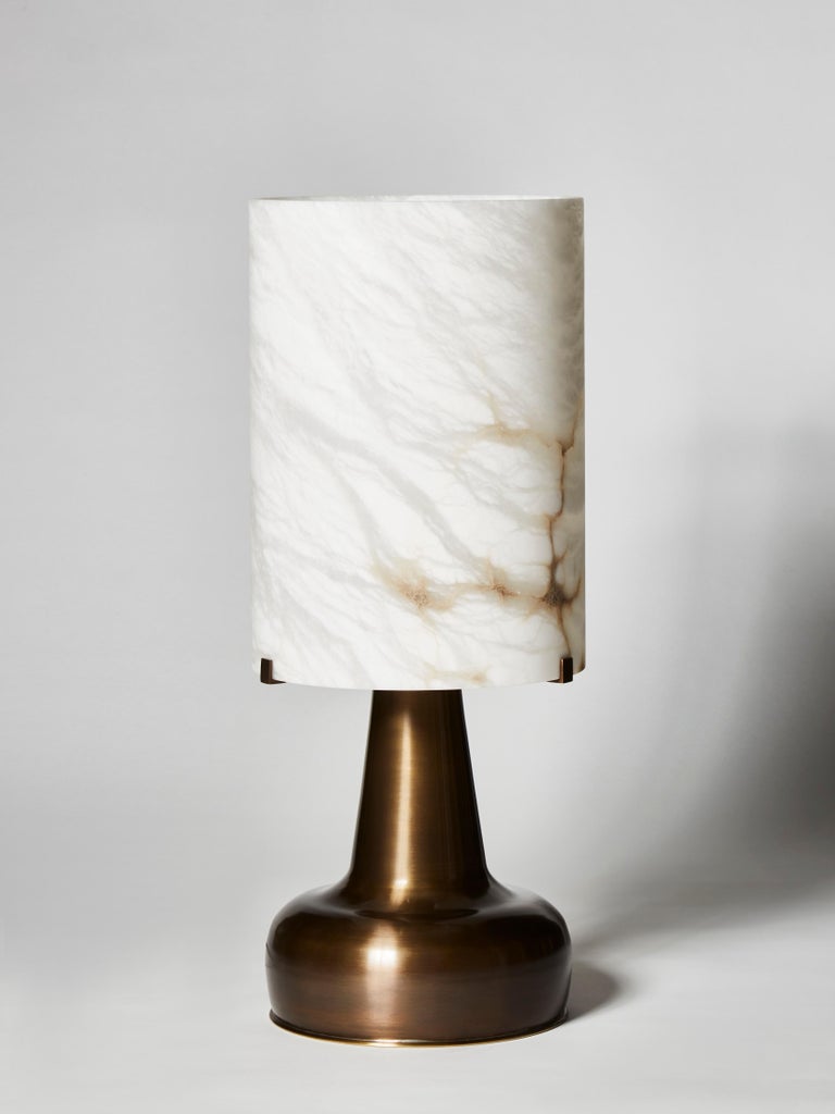 Table lamps made of pear shaped brass feet inspired by the 1950s and topped with an alabaster lamp shade.

Designed by Glustin Luminaires

Can be bought separately, price displayed for one lamp.
 