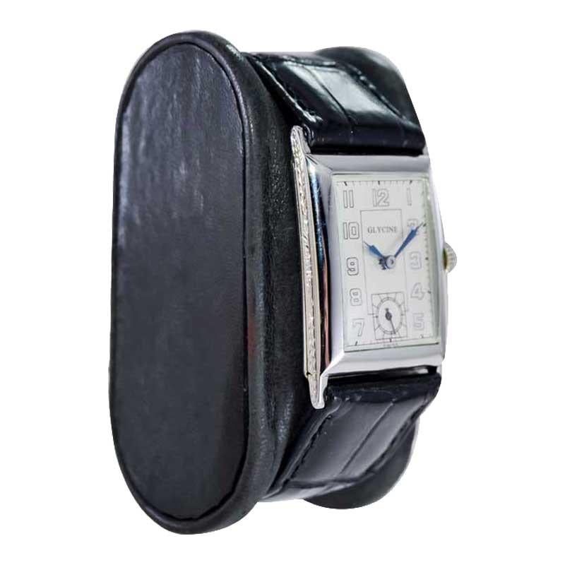 FACTORY / HOUSE: Glycine Watch Company
STYLE / REFERENCE: Art Deco Tank Style 
METAL / MATERIAL: 18Kt. White Gold 
CIRCA / YEAR: 1930's
DIMENSIONS / SIZE: Length 36mm X Width 23mm
MOVEMENT / CALIBER: Manual Winding / 17 Jewels / High Grade
DIAL /