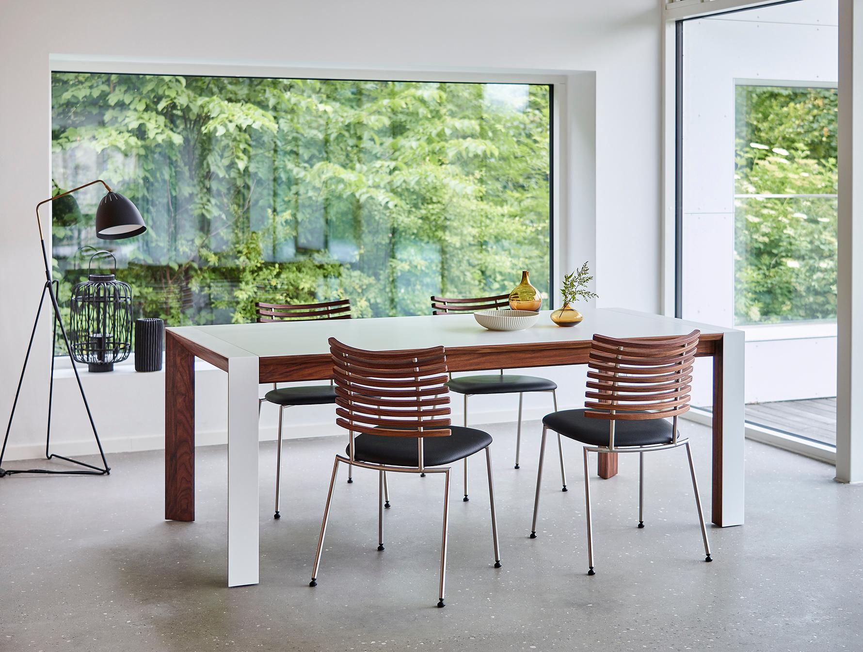 GM 7700 is an elegant table with clean lines and advanced details. The exclusive material Corian is combined with wood which forms a beautiful contrast – consistent with the Scandinavian simplicity and passion for good craftsmanship that