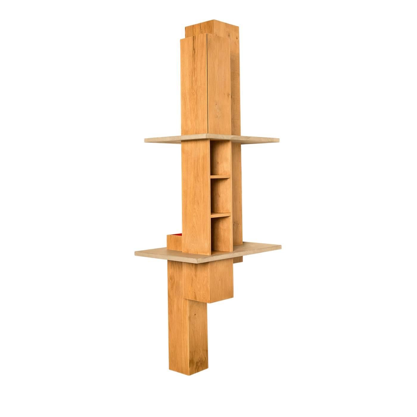 This skilfully crafted oak and concrete bookshelf by Giacomo Moor is made up of three vertical storage compartments which offer shelving as well as a closed cupboard. The top of the smaller beam, which rests on the floor and emerges from the first
