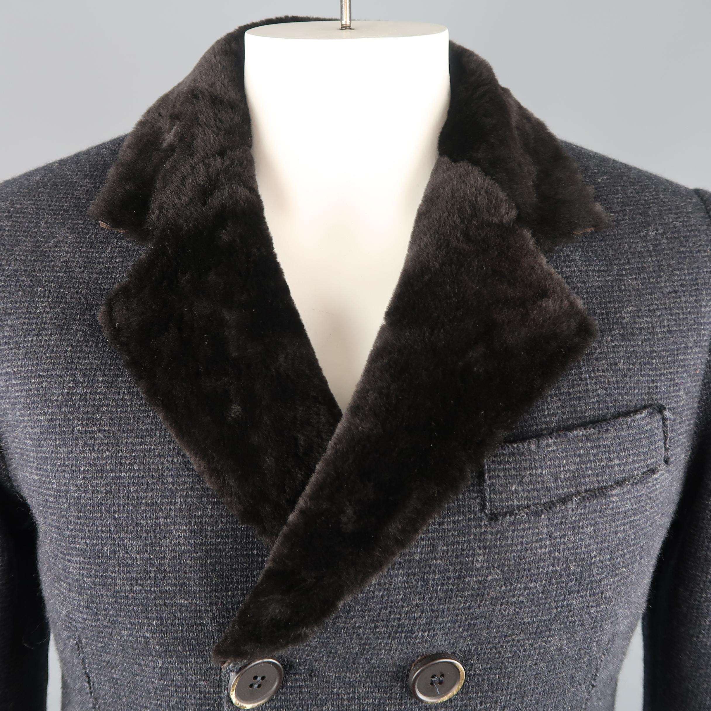 GMS-75 over coat comes in navy and gray wool blend knit fabric with a double breasted button up front, flap pockets, suede elbow pads, brown shearling lapel, and faux fur liner.
 
Excellent Pre-Owned Condition.
Marked: (no size)
 
Measurements:
