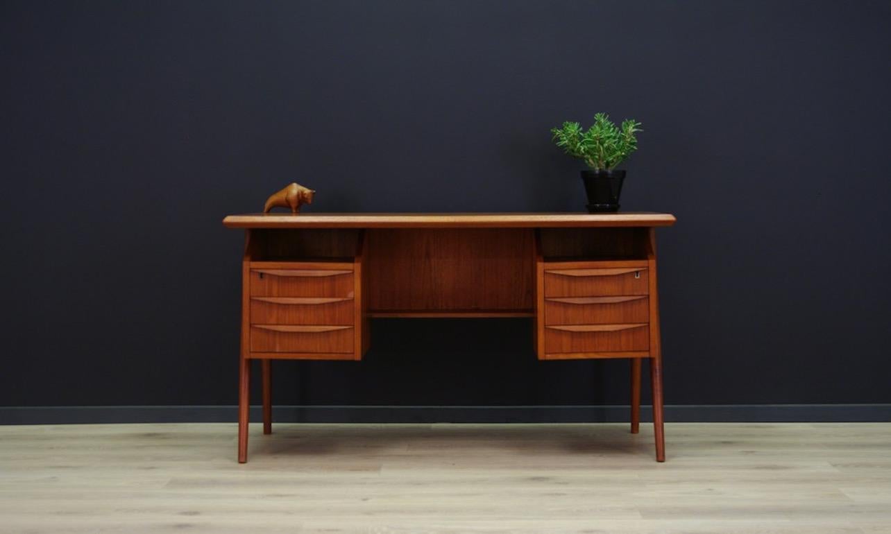 Original desk from the 1960s-1970s, Scandinavian design. A brilliant form designed by Gunnar Nielsen Tibergaard. Unconventional handles. A desk covered with teak veneer with six drawers, an additional advantage is its double-sidedness, on the back a