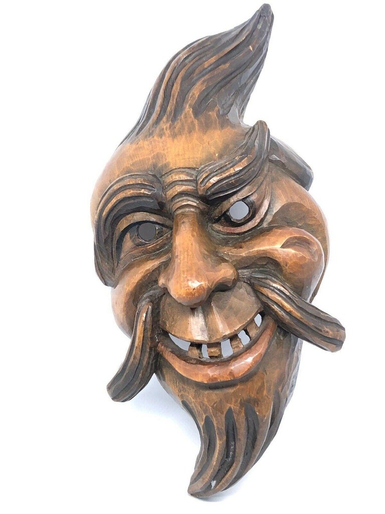 Beautiful Black Forest Folk Art wood carved mask. This is a wonderful example of Black Forest carving. This can be used as a Wall decoration or as a wearable mask. Found at an estate sale in Vienna, Austria.