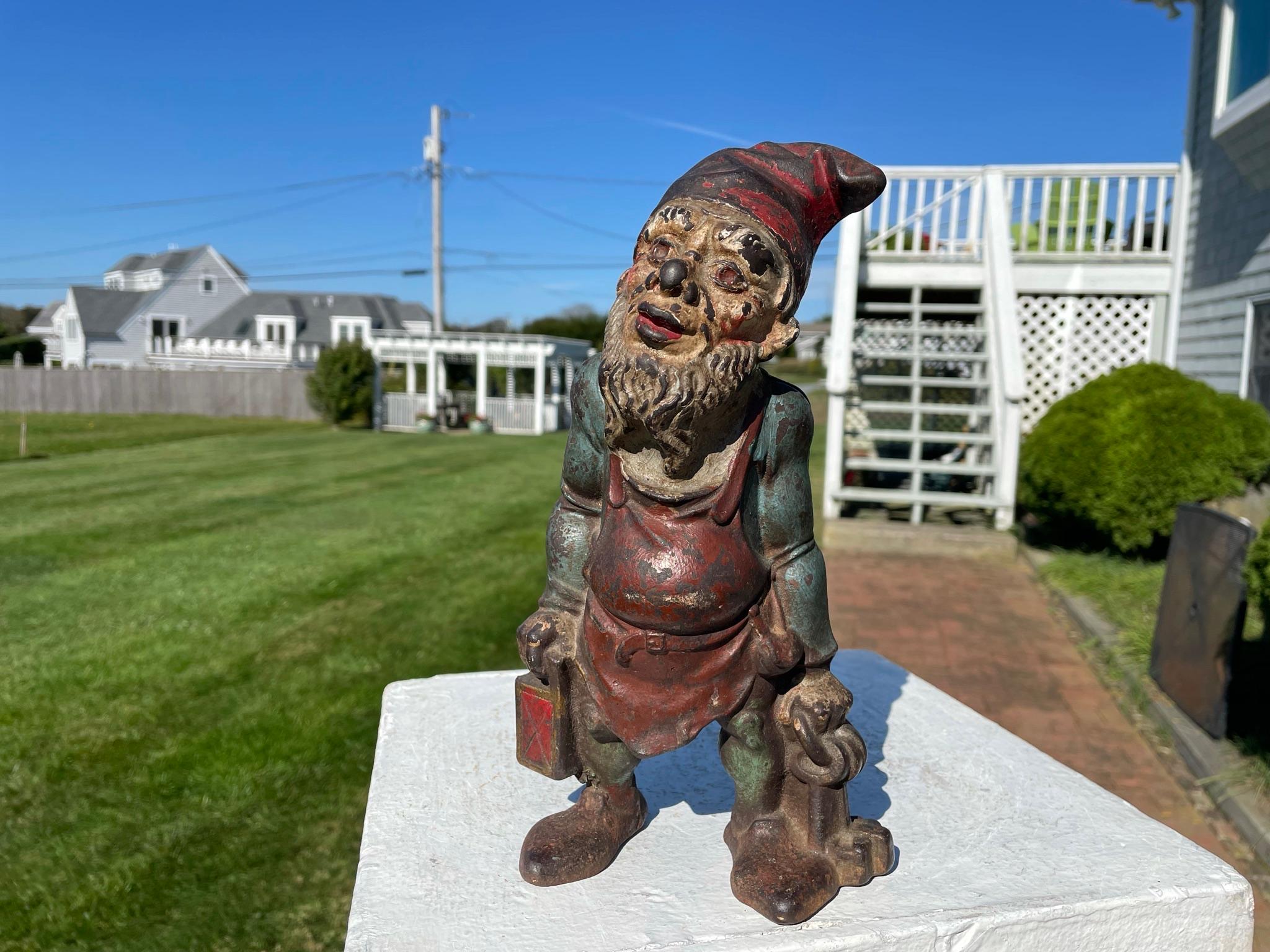 Nostalgic opportunity.

America's friendly gnome- a Garden Gate Keeper With Lantern Sculpture also known as 