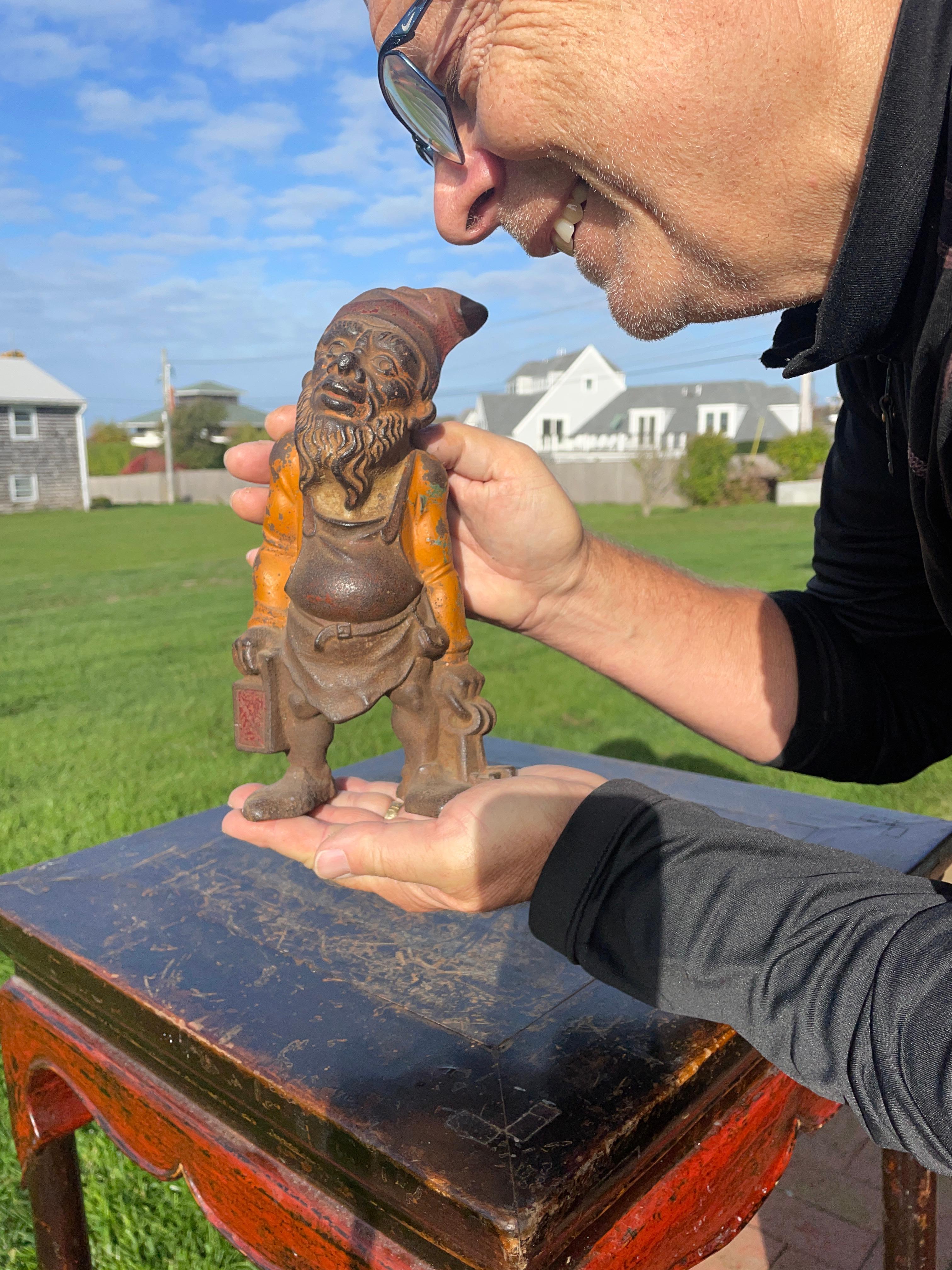 A good luck gnome in a rare old orange color for your special indoor or out door space.
Nostalgic opportunity.

America's friendly gnome- a Garden Gate Keeper With a Night Lantern Sculpture also known as 