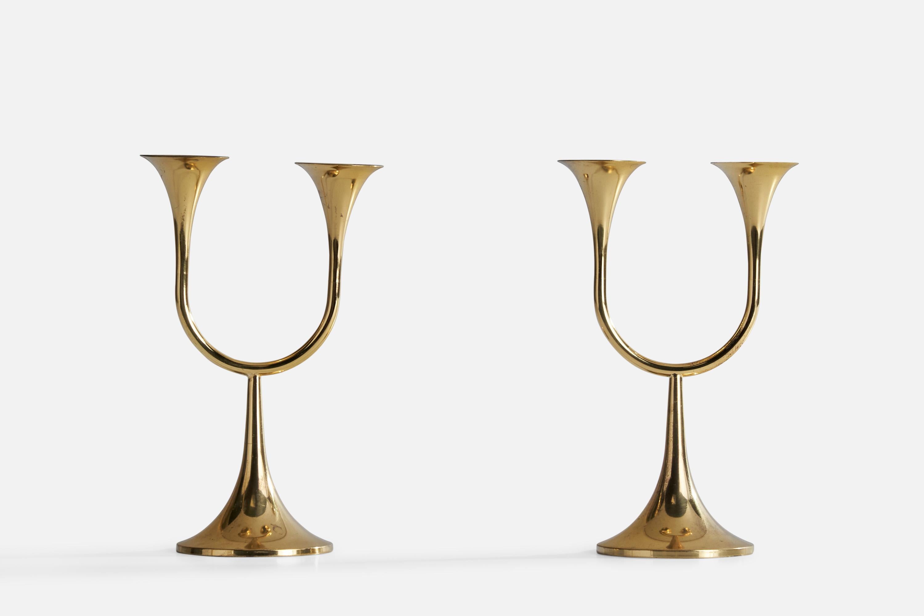 A pair of brass candlesticks designed and produced in Sweden, c. 1960s.

Holds .5” diameter candles.