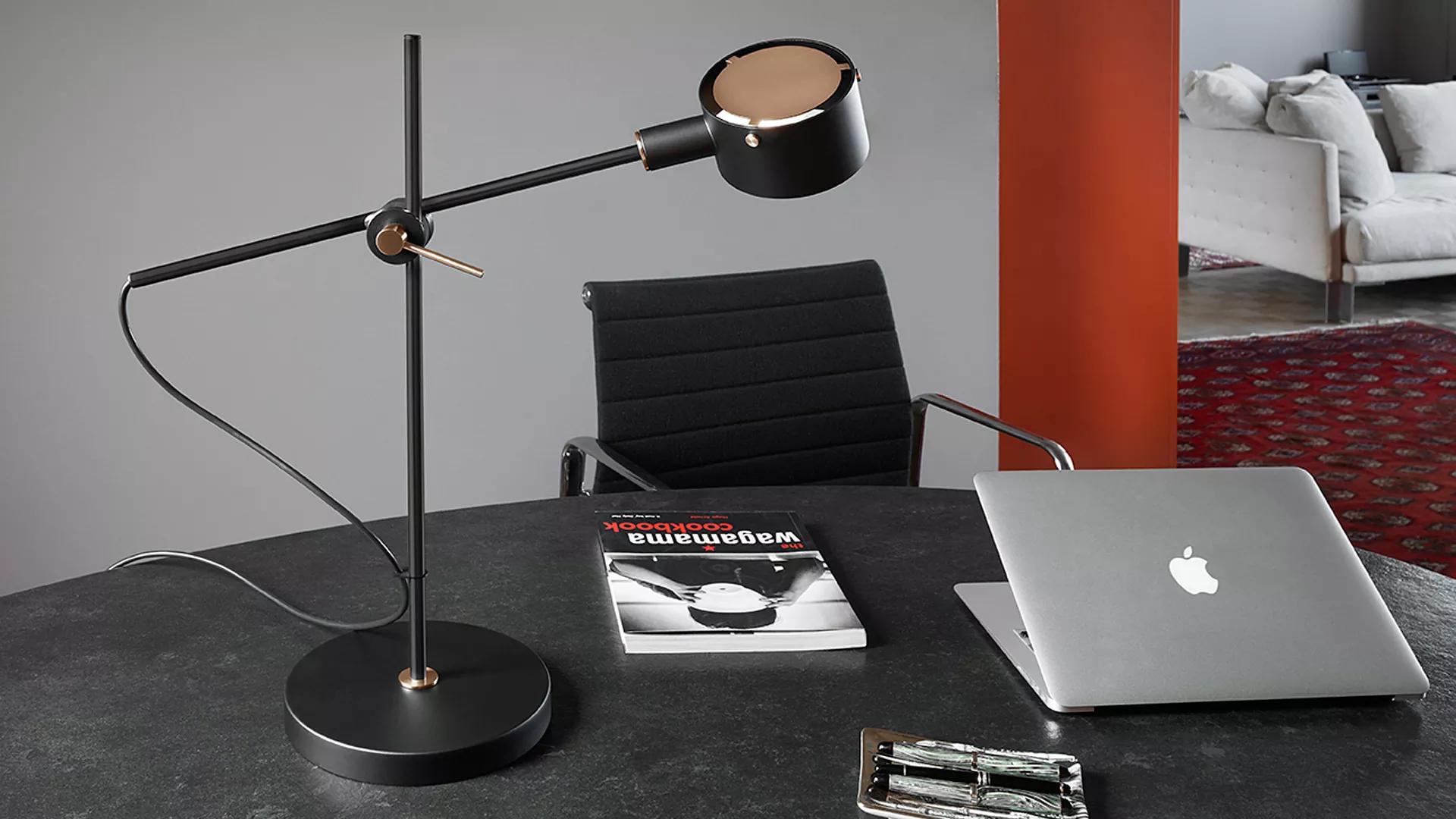 Giuseppe Ostuni Model 252 'G.O.' table lamp in black for Oluce. 

Originally designed by Giuseppe Ostuni in the 1960s, this iconic re-edition is still crafted by Oluce in Italy using many of the original manufacturing techniques with scrupulous