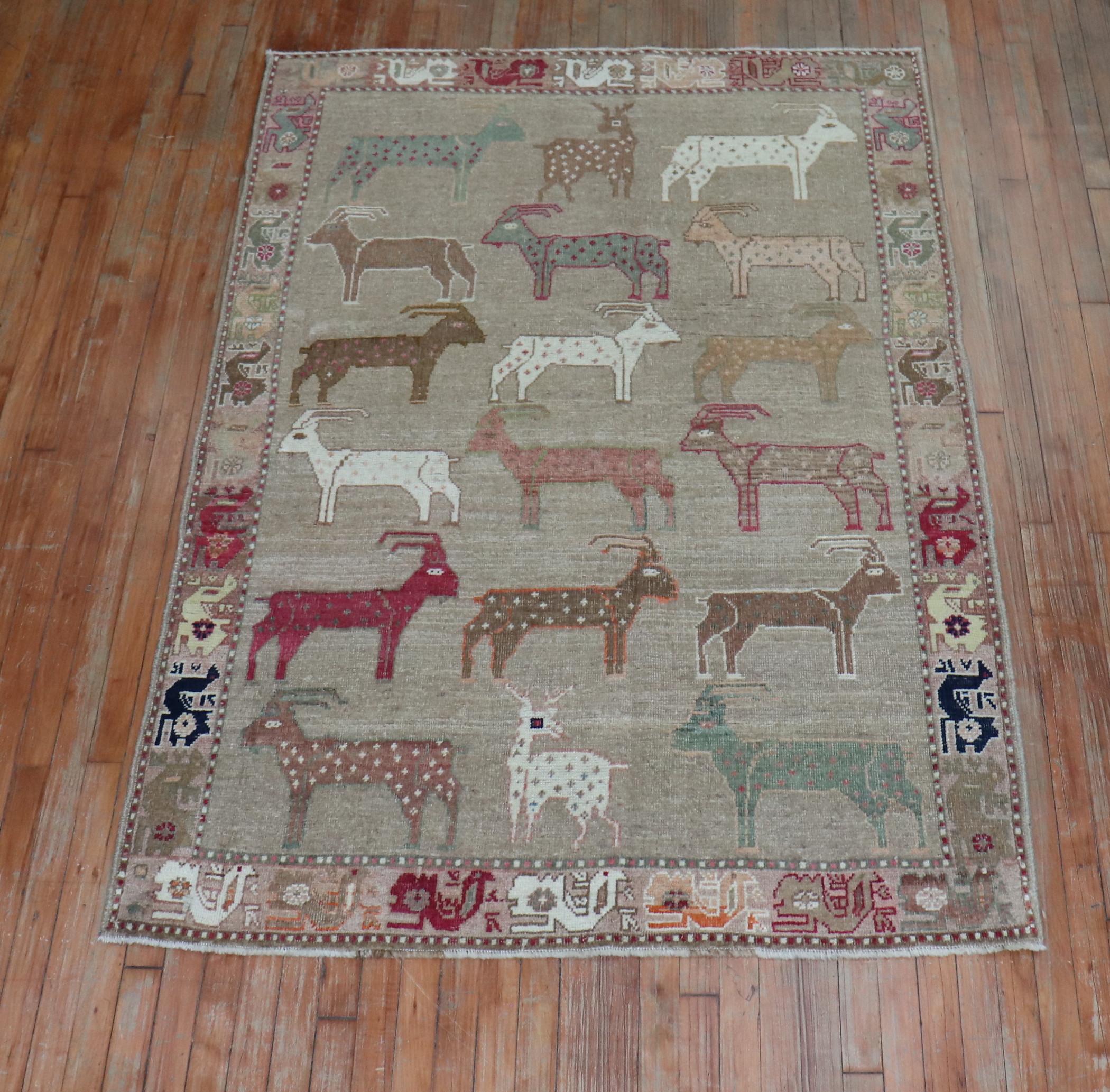 A late 20th century one of a kind Persian Gabbeh rug depicting a mixture of 18 colorful different goats and deers on a brown ground, second half of the 20th century. 

Measures: 4'7'' x 6'6''.