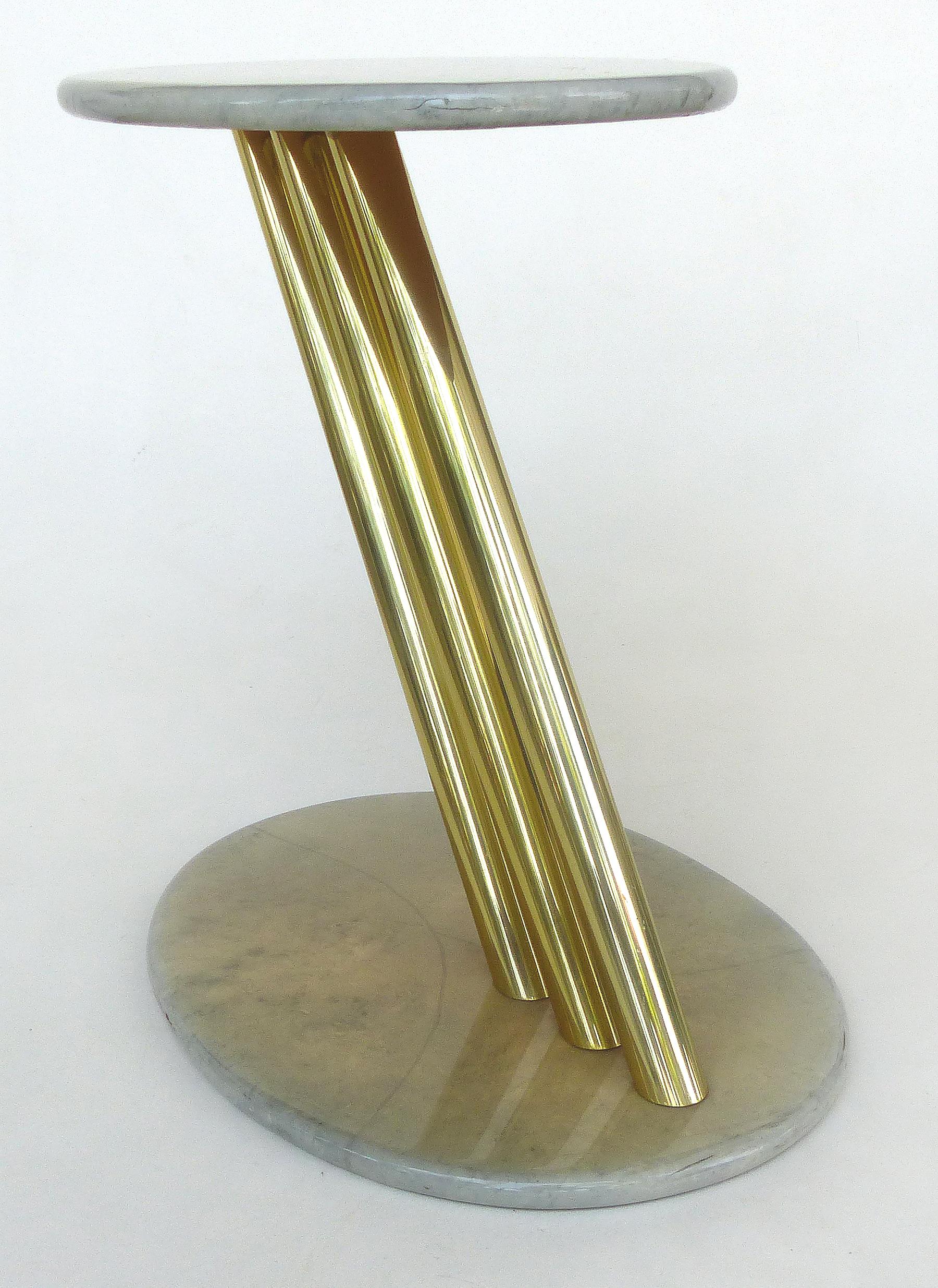 Goatskin & Brass Asymmetrical Side Table

Offered for sale is a mid-century modern asymmetrical side table with a lacquered goatskin clad top and base supported by three tubular brass stretchers.