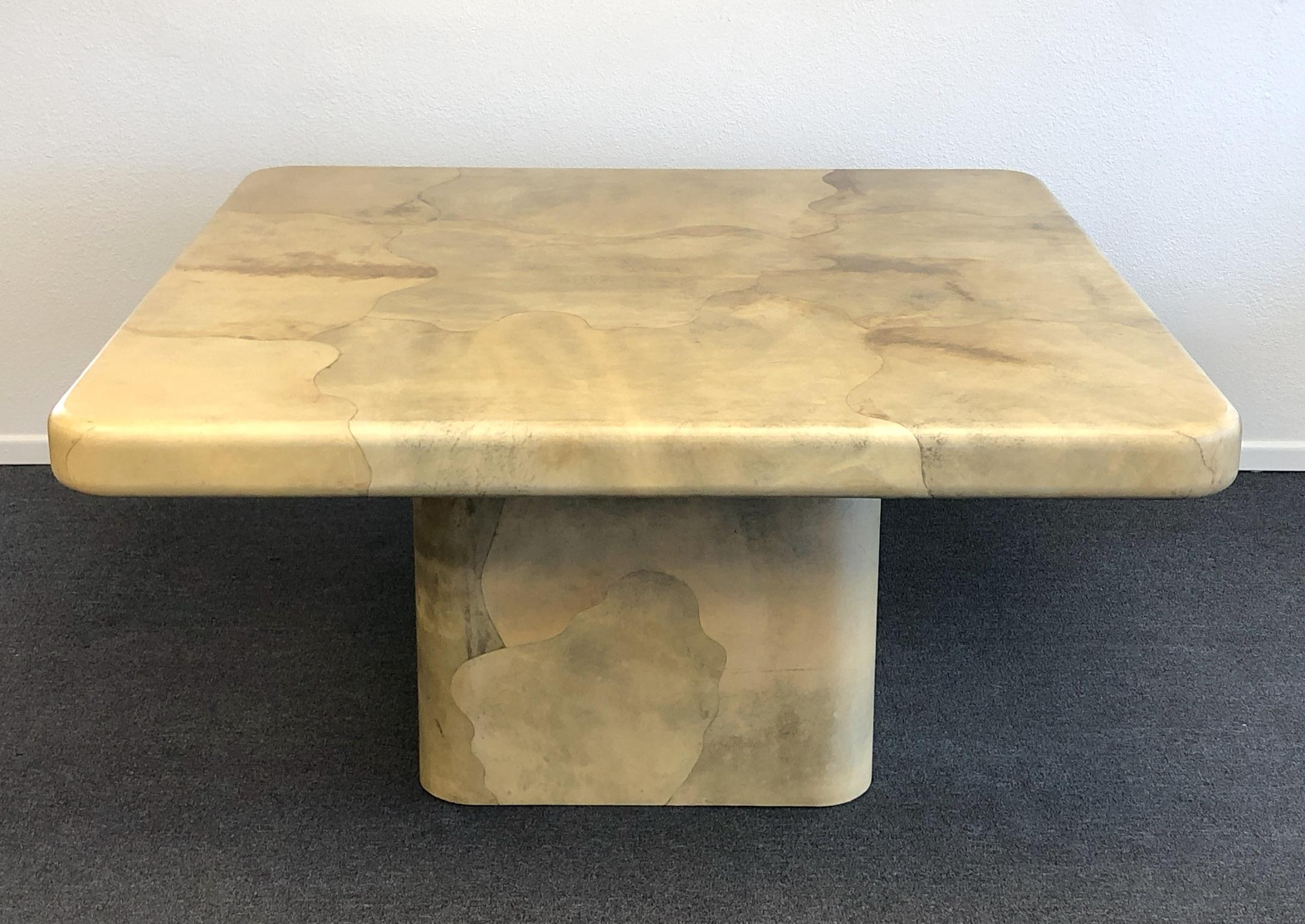 A amazing goatskin dining table design by renowned designer Karl Springer in the 1980s. The table it’s constructed of wood that’s covered in goatskin and then lacquered. The tops underside is covered in goatskin also. The table is in beautiful