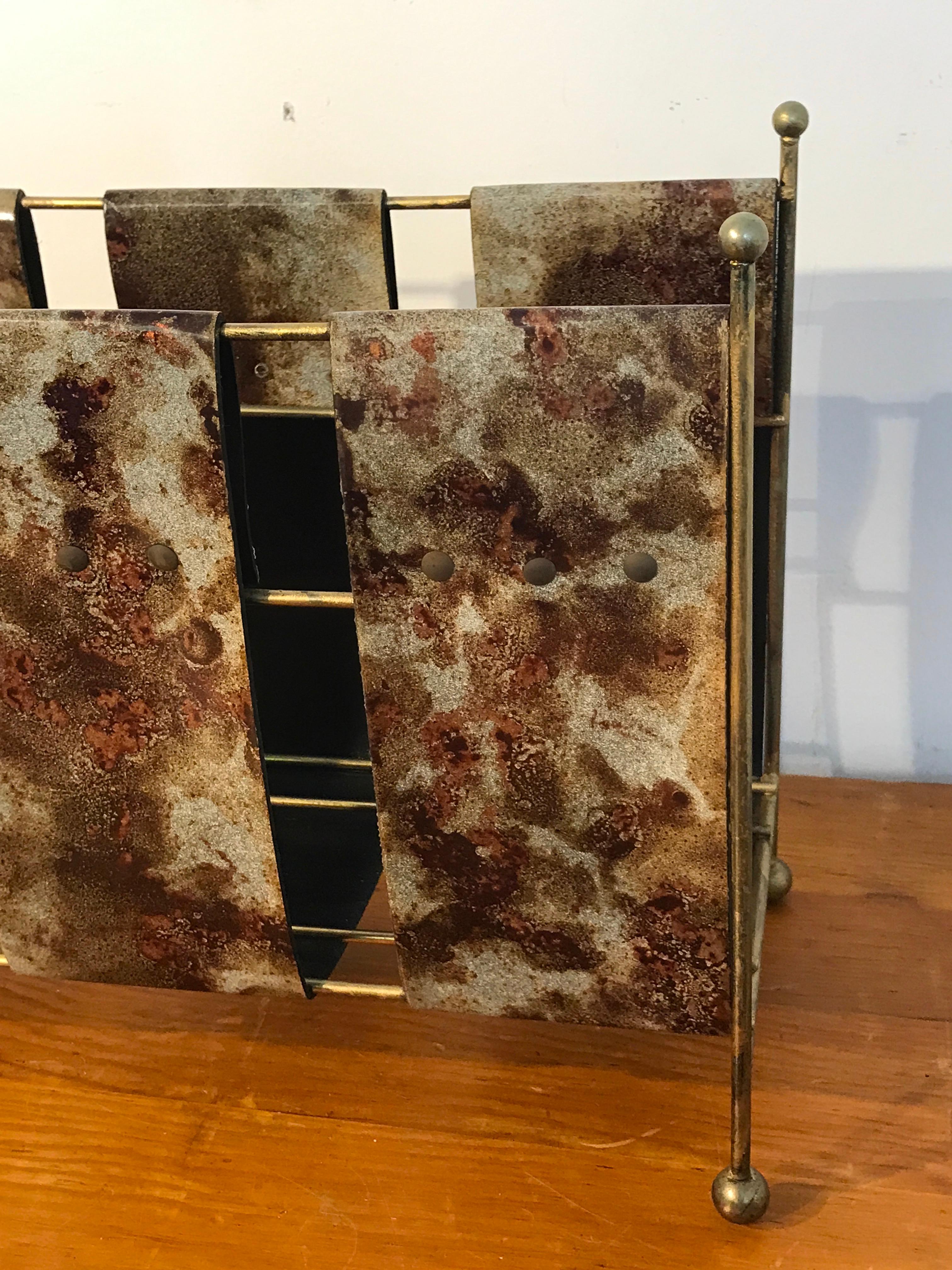 Goatskin Magazine Rack by Aldo Tura, with three goatskin lacquered straps, on a gilt metal stand. With an interior measuring 6.5