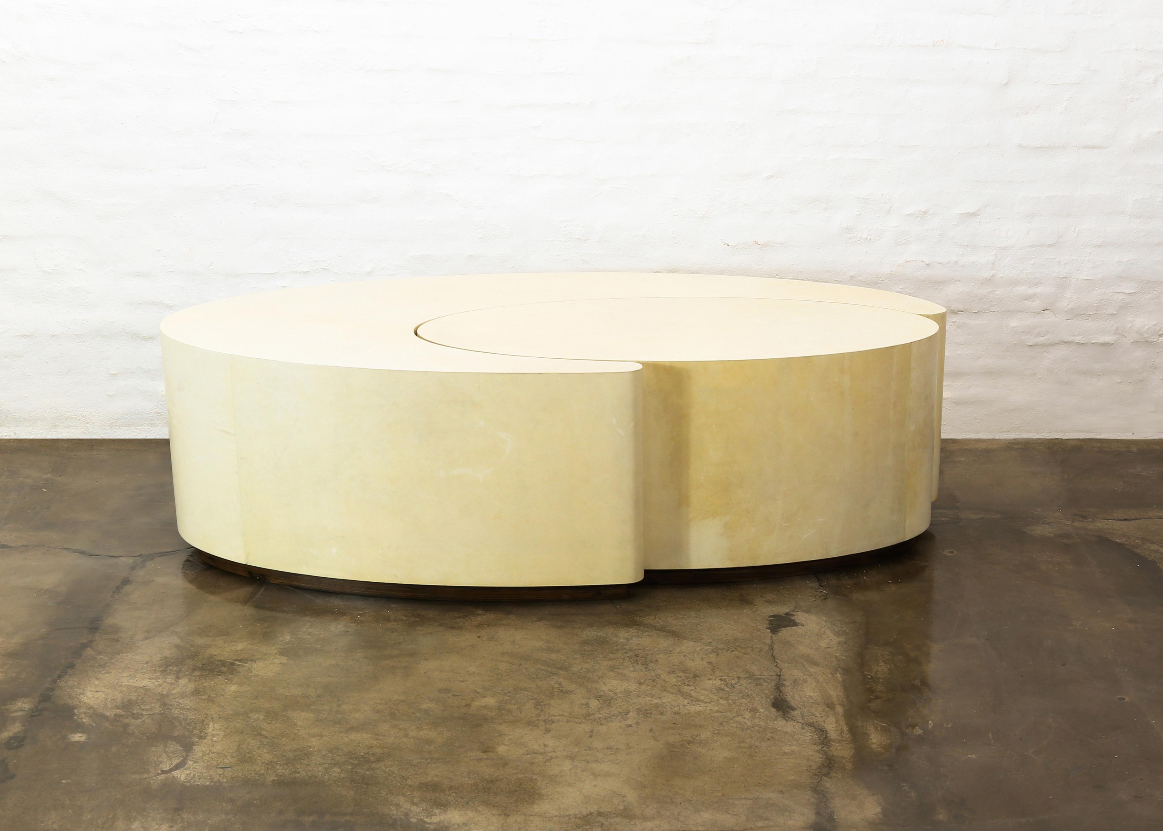 Cadenza Parchment Modern Sculptural Nesting Coffee Tables.

The Cadenza Nesting tables are handcrafted out of wood wrapped with geniune Argentine Goatskin, shown here in a natural finish, and can be pushed together to form one large oval, or moved