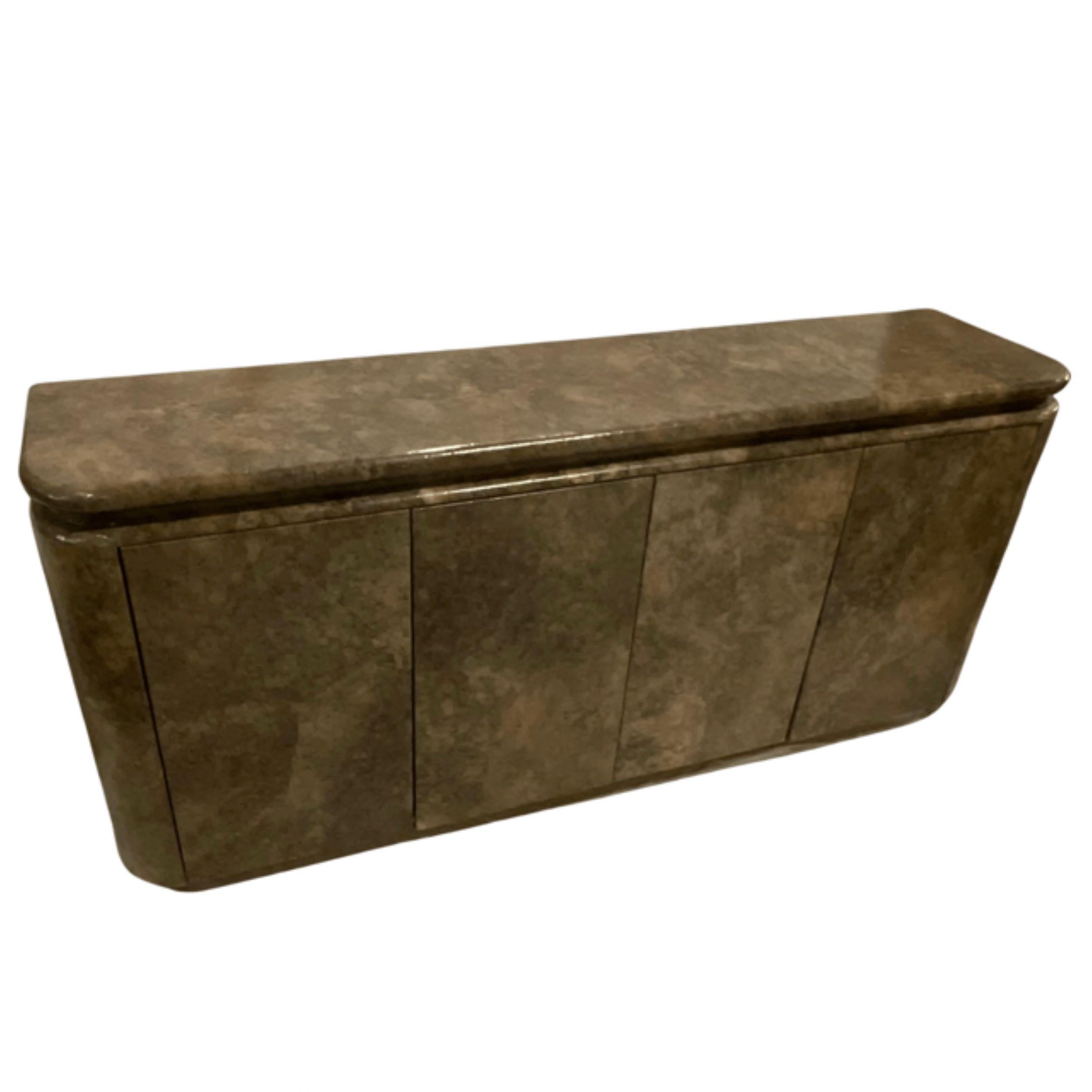 Post-Modern
Goatskin Parchment Credenza
4 Doors
2 Compartments
1 Shelf creating 2 Levels Inside
Marbled appearance
Overall Tones: taupe, mushroom, brown, tan.
 
