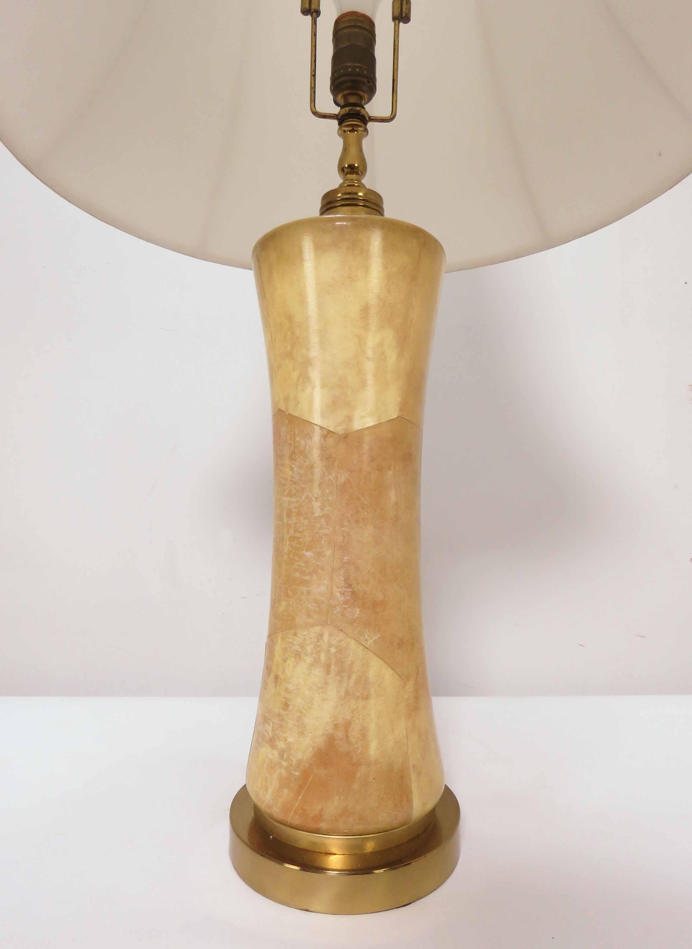 Table lamp in real goatskin, solid brass hardware, adjustable height harp. Based on style elements and quality, attributed to Aldo Tura.

Measures 36