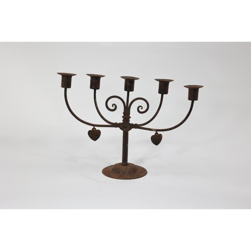 Goberg Germany. A five branch handmade iron candelabra. In 1895 Hugo Berger (Goberg) started decorative ironwork in Schmalkalden Germany his first factory. Goberg's work is in the Arts and Crafts tradition using iron and brass. His items were sold