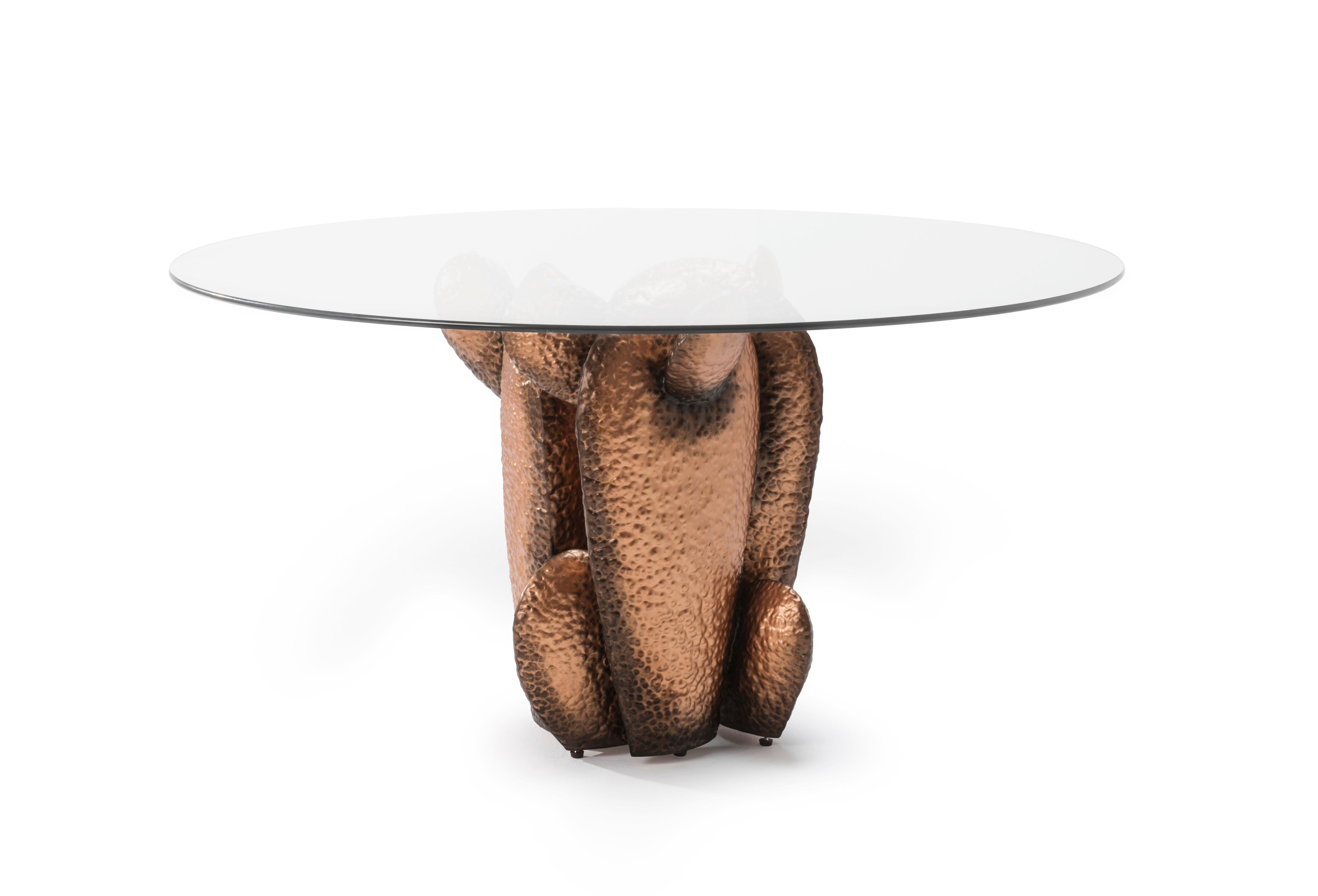 Gobi dining table by Kenneth Cobonpue
Materials: Steel, Glass. 
Dimensions: 
Glass diameter 150 cm x height 19mm 
Base 60 cm x 58.5 cm x height 75 cm

Inspired by the characteristic form of the cactus, Gobi is a striking set of tables with its