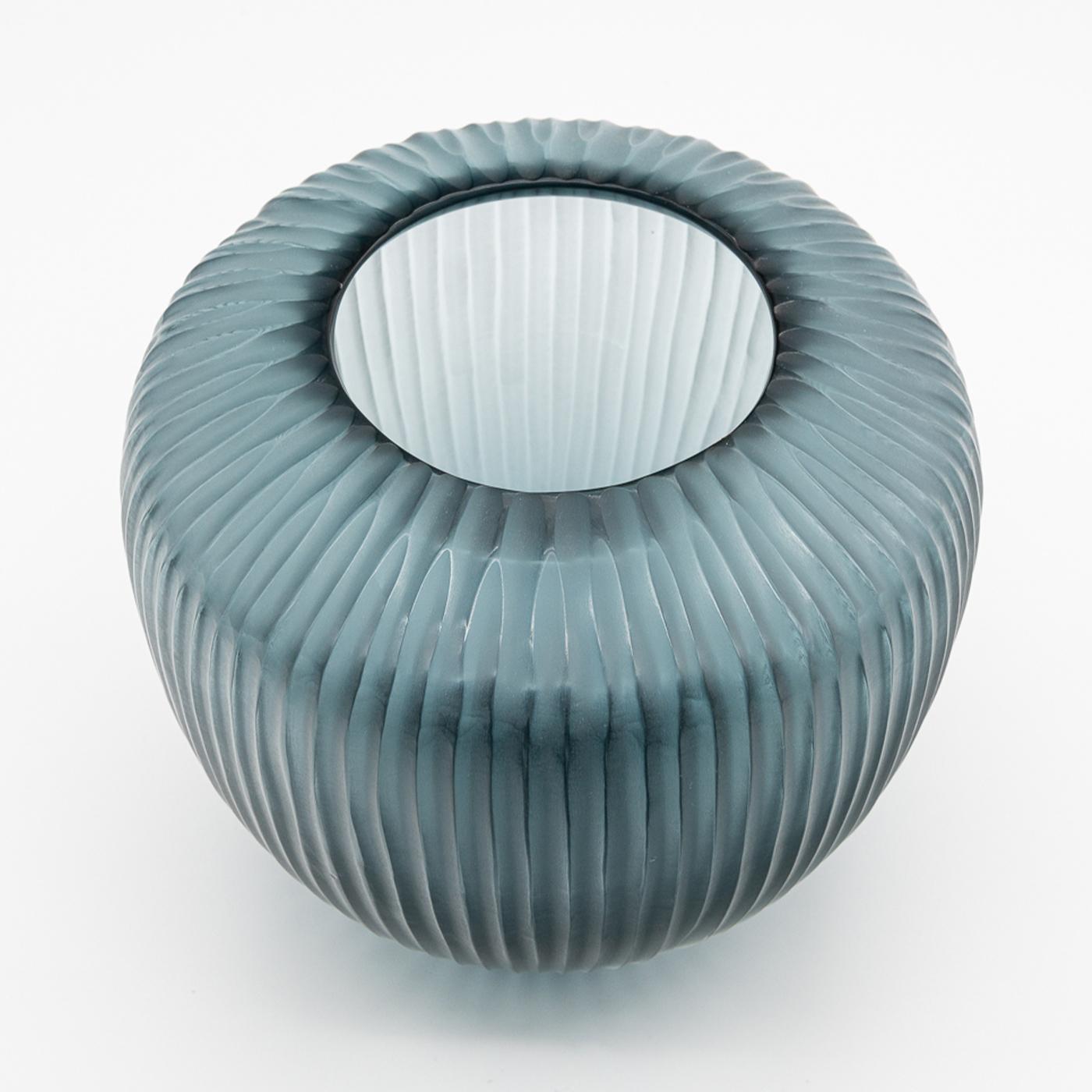 Inspired by Greek and Roman amphorae, this unique vase takes its name from the Italian word for drop, expressed through its elegant elongated form. Hand-finished using traditional Muranese cold carving and polishing techniques to enhance the